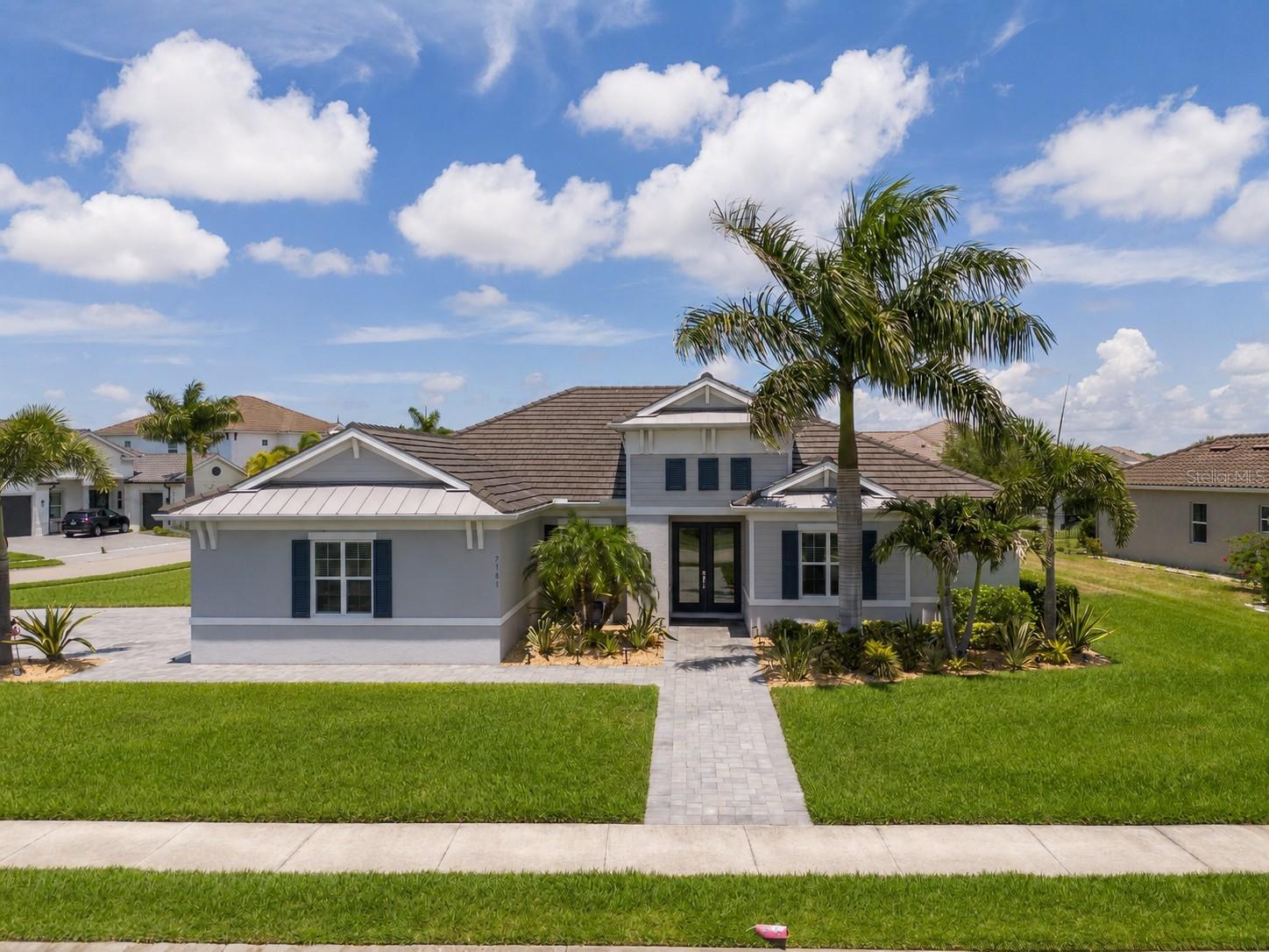 PREMIUM CORNER LOT • SCREENED POOL • OVERSIZED 3-CAR GARAGE • OPEN-CONCEPT FLOOR PLAN • LOW HOA • NO CDD FEES

Nestled on one of Waverley’s premier corner homesites within Sarasota’s exclusive gated community of just 100 homes, this beautifully maintained residence offers exceptional privacy, generous outdoor space, remarkably low HOA fees, and no CDD fees.

This spacious 4-bedroom, 3-bath home features an oversized 3-car garage, a dedicated private office, and a thoughtfully designed single-story floor plan that perfectly balances open-concept living with everyday comfort and functionality.

At the heart of the home, the bright and well-appointed kitchen offers a spacious center island, quartz countertops, abundant cabinetry, stainless steel appliances, and generous workspace creating an ideal gathering place for family and entertaining.

Large windows and expansive sliding glass doors fill the home with natural light while creating a seamless connection between the interior living spaces and the private outdoor retreat. The intelligently designed layout provides excellent separation between the owner’s suite, guest bedrooms, and office, offering both privacy and flexibility for today’s lifestyle.

The owner’s suite is spacious and inviting, complemented by a large ensuite bath and generous walk-in closets. Throughout the home, the exceptional level of maintenance and pride of ownership is immediately apparent, offering buyers a truly move-in-ready residence.

Step outside to the screened lanai and sparkling pool, where covered and open-air living spaces create the perfect setting for year-round Florida living. Whether enjoying a quiet morning, relaxing by the pool, or entertaining guests, the outdoor living area offers comfort, privacy, and effortless indoor-outdoor living.

Additional highlights include an oversized three-car garage with epoxy flooring, a spacious laundry room with abundant storage, and a smart irrigation system conveniently controlled from your phone.

Built by Medallion Home, Waverley is known for its Mediterranean and Caribbean-inspired architecture, boutique atmosphere, low HOA dues, and convenient location just minutes from Sarasota’s award-winning beaches, UTC shopping and dining, Lakewood Ranch, top-rated schools, golf courses, and everyday conveniences.

Beautifully maintained and ideally positioned on one of Waverley’s most desirable corner lots, this exceptional residence combines a highly functional floor plan, generous indoor and outdoor living spaces, outstanding privacy, and an unbeatable Sarasota location offering a rare opportunity to enjoy the very best of Florida living.