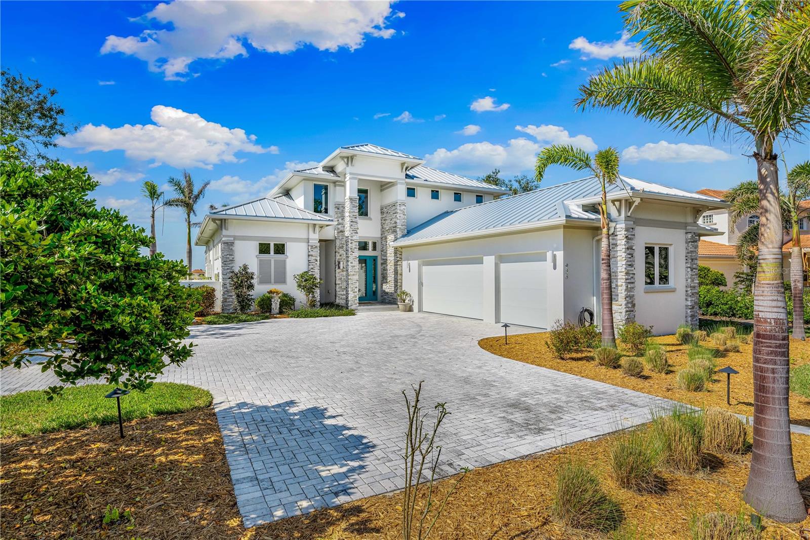 This stunning coastal waterfront estate is a fishing and boaters' dream. This property promises the sought-after Florida sunsets night after night! This private oasis sits on .65 acre and establishes security with a private solar powered gate. Walking into the foyer you experience the open floor plan with a linear gas fireplace in the great room, and high end finishes throughout. Pocket sliders line the great room, kitchen, and owner’s suite, with breathtaking views of the intracoastal that provides an abundance of natural light! The flow from the kitchen to the great room provides functionality for everyday living or entertaining. The kitchen provides stainless steel Thermador wifi-compatible appliances, a convection double oven, glass induction cooktop, microwave drawer, and an oversized refrigerator with two ice makers! It is also fitted with Italian tile backsplash! The Owners' suite is conveniently located on the first floor with the same beautiful views, a large shower, and a favorable walk-in closet. Other features of this spectacular home include a Sonos sound system, and an elevator to the 2nd floor. The elevator opens up to a loft and three additional bedrooms. Two of the three bedrooms include ensuites with a private patio and breathtaking views to the North and South of the intracoastal waterway. The 3rd bedroom shares the public bathroom. Once outside there is a spacious lanai with a fully equipped outdoor kitchen, including seating versatility for dining, watching your favorite tv programs, and entertaining. The lanai is also equipped with a linear gas fireplace, powered sun and storm shades, and a Sonos sound system. After a short walk down to the dock you will find easy access to a 10,000 lb boat lift with remote control operation. There is electric and a fresh water source for convenient fish and boat cleaning.  Just 1.1 miles from Nokomis Beach, this estate allows for a quiet and private lifestyle and is within a short drive to vibrant downtown Venice and Sarasota. Don’t miss out on your chance for Coastal living!

*Dont forget to click the virtual link*

*This is turnkey optional*