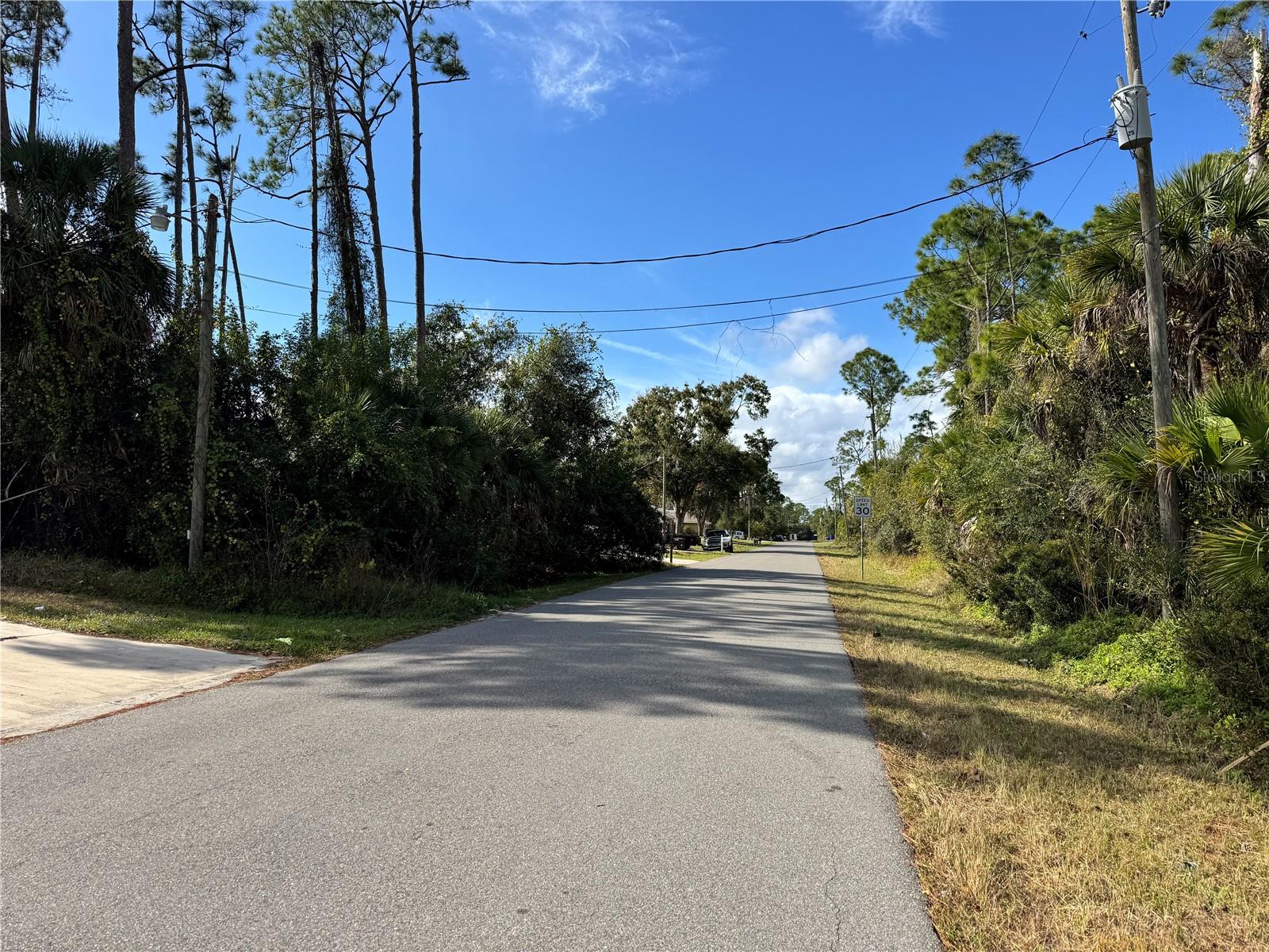 Discover an exceptional opportunity to build in one of Florida’s fastest-growing cities. This residential homesite on TISHMAN Avenue is situated in an X FLOOD ZONE, backs to the neighbor's side yard (not the house) lot for added privacy, and power is readily available at the street for a smoother development process. This location has convenient access to I-75 and US-41 Tamiami Trail, connecting you to area amenities such as Wellen Park, Atlanta Braves spring training stadium, Warm Mineral Springs, outstanding shopping, dining, medical and schools. The lot is well-suited for a custom home or a spec build designed to meet today’s buyer needs, such as modern floor plans, outdoor living spaces, and upscale finishes. With North Port’s rapidly expanding population, low carrying costs, and ongoing commercial and industrial growth, this homesite provides a smart, forward-looking investment in a unique market. Seller has multiple lots available, call for details.