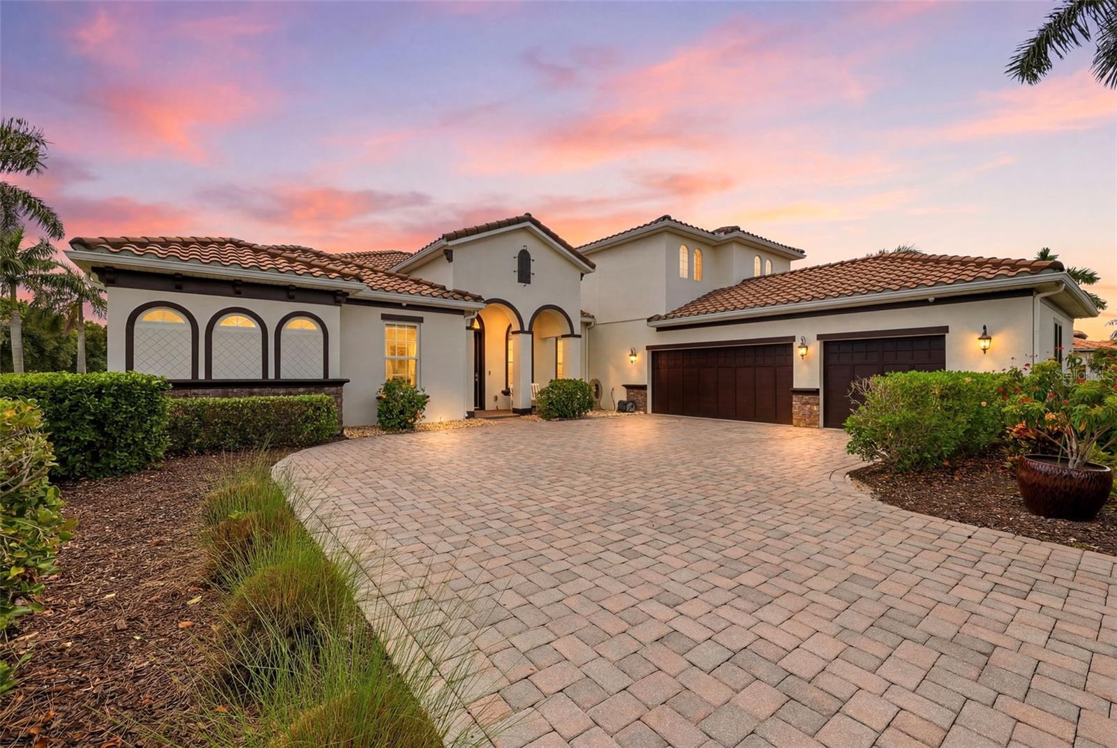 BRAND NEW EXTERIOR PAINT. This 3800 plus sq. ft. Osprey C model is a must see with four bedrooms, four bathrooms, separate office, large bonus room with full bathroom, bamboo and tile floors throughout, and impact resistant windows and impact resistant remote screens on the lanai. Situated in Rye Wilderness, a community with half acre lots, no CDD, low HOA, and top schools, the home has wonderful curb appeal with tile roof, longer paver driveway to a three-car side load garage and beautiful pond and preserve views. Enter the home through the ornamental glass entry door to an expansive dining room and living room area with fantastic views of the covered lanai, pool and pond. The master suite has an office forward, large master bedroom with sliders to the lanai, walk-in closet and second closet, and double sink bathroom with walk in shower and garden tub. The updated kitchen includes THREE ovens, large island with breakfast bar and sink, upgraded gourmet kitchen cabinets with ample storage, tiled back splash and large walk-in pantry. There is a second living room off the kitchen with a larger slider with views to the lanai, pool and pond. There are two bedrooms with a shared/guest bathroom adjacent to this living room. The fourth bedroom includes an ensuite and an under stairs large walk-in closet. Upstairs you will find a bonus room, two closets (one a walk-in) and a full bathroom with walk-in shower. With several windows providing beautiful views to the preserve across the street and abundant natural light, this space has many options including a possible fifth bedroom, game room, workout room, or office.  With one of the largest undercover lanais in Rye Wilderness, the home offers a grand gathering space with potential to create the outdoor kitchen of your dreams. The impact resistant motorized screens will protect the home and outdoor space.  Enjoy the salt water, solar heated pool with views of the large pond and beautiful sunsets through the full clearview screen. Situated just north of Lakewood Ranch and Sarasota with Anna Maria Island to the west and St. Pete and Tampa to the north, Rye Wilderness is perfectly located. You will find local restaurants and shopping just minutes away along with Rye Wilderness Park and Fort Hamer Park for hiking, kayaking and boating with access to the big bays within minutes.