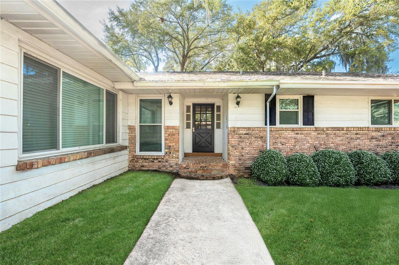 Virtually Staged. Welcome to this charming one-story home in the desirable Belle Isle / Lake Conway Estates community, offering deeded access to the Conway Chain of Lakes and an optional HOA with access to the community boat ramp.

Situated on just under a quarter-acre beneath a beautiful mature oak tree, this property provides shade, curb appeal, and functional outdoor space. The fenced backyard features a double gate, ideal for storing water sports equipment, boats, or trailers, along with a two-car garage.

Inside, this 4-bedroom, 2.5-bath home offers a versatile layout with an additional bonus room that can serve as a bedroom, home office, or den. The formal entry welcomes you with real oak hardwood floors and leads into multiple flexible living spaces.

The owner’s suite includes a remodeled en-suite bathroom with double vanities and a pebble-floor walk-in shower, as well as spacious cedar walk-in closets. Secondary bedrooms are generously sized and share a convenient Jack-and-Jill bathroom. The bonus room features a fireplace, creating a cozy space for relaxing, reading, or working from home.

Additional updates include energy-efficient AMI windows throughout, updated electrical panel, PEX replumbing, a 2017 roof, and a functioning HVAC system.

Schedule your private showing today to see all that this Lake Conway area home has to offer.