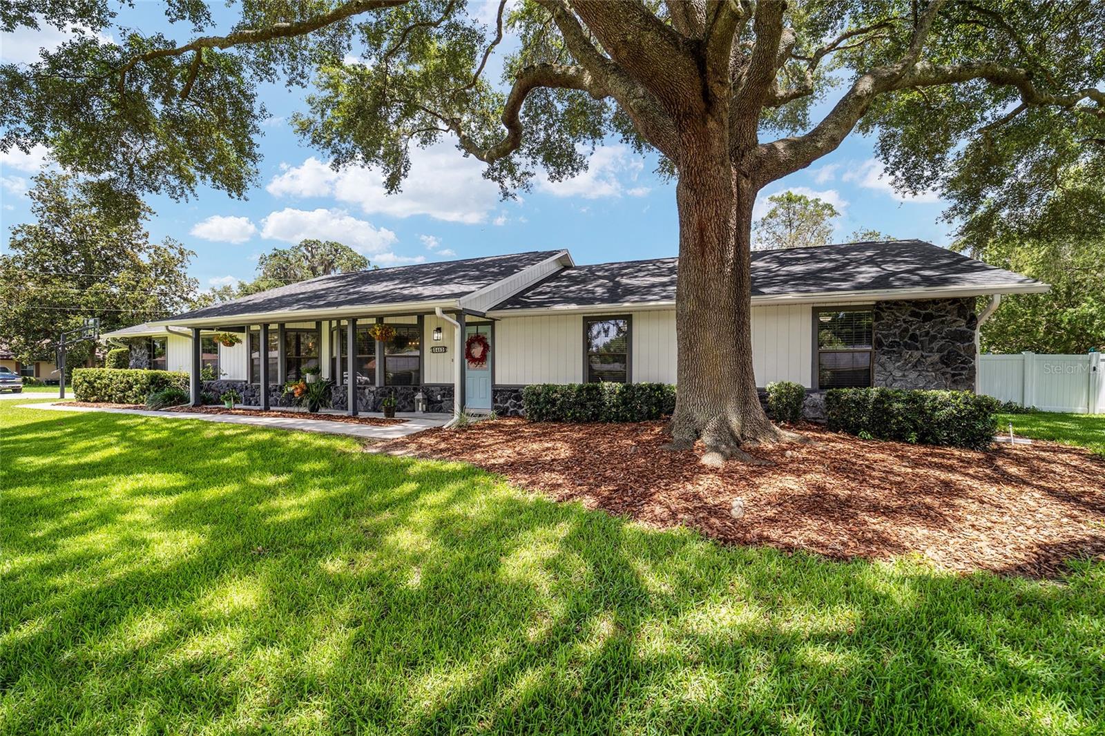 Curb appeal abounds at this newly renovated SE Ocala pool home! This 3-bedroom, 2-bath residence offers stylish updates throughout, plus a versatile bonus room with its own exterior entrance via the garage — ideal for a private office, production studio, hobby space, or future in-law suite. The possibilities are endless! Inside, you’ll find a beautifully updated chef’s eat-in kitchen with custom tile backsplash, luxury vinyl plank flooring throughout, 7 1/2" baseboards, a renovated guest bathroom with double vanity, and an updated primary suite featuring an accent wall and refreshed bath. The spacious Florida room adds even more flexible living space, includes a beverage bar, and overlooks the expansive backyard. Step outside and enjoy a fully fenced backyard designed for relaxing and entertaining, complete with generous patio areas and a sparkling pool that was recently overhauled with new tile and mar-cite finish. Located in the highly desirable Osceola Middle School and Forest High School districts, this home combines location, updates, and excellent livability in one incredible package. Recent updates include Roof 2020, Water Heater 2021, Whole-House Replumb 2025, Interior Renovation 2025, and Pool Renovation 2026. Don’t miss this move-in-ready SE Ocala gem!
