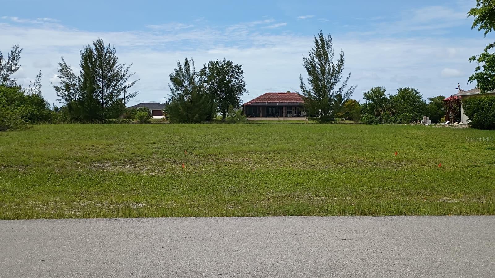 Exceptional waterfront homesite in desirable NW Cape Coral! This oversized lot features approximately 120 feet of canal frontage with a seawall already in place, offering significant value and savings for future development. Enjoy beautiful water views, boating, fishing, and the peaceful Florida lifestyle. A great opportunity to build your dream home or invest in one of Cape Coral's growing waterfront areas.