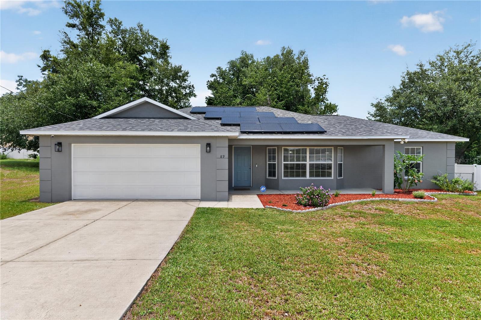 Fresh updates meet functional living in Silver Springs Shores, a location that keeps you close to just about everything. This 3/2 home offers a practical split-bedroom layout, fresh interior and exterior paint, new flooring through the main living areas, updated fixtures throughout, and a refreshed kitchen featuring new cabinets and new appliances. Exterior brings even more value with fresh landscaping, a fully fenced yard, surveillance system, water softener system, and a NEW roof with solar capabilities to help support lower monthly utility costs. Situated in the Forest High School district, you're also located close to shopping, dining, schools and close proximity to a nearby Greenway access point — giving you immediate entrance to trails, nature, and one of Ocala's best outdoor perks. Updated where it counts and positioned in a convenient Ocala location, this one checks a lot of the right boxes.