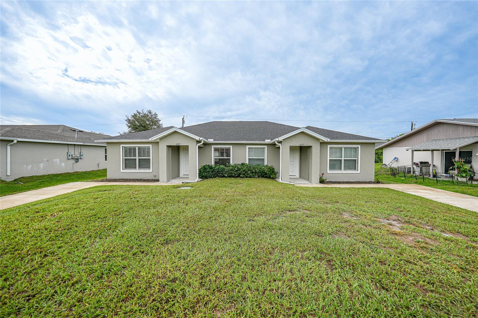 One or more photo(s) has been virtually staged. Opportunity knocks with this nearly new 2023-built duplex, located at 11057 & 11059 Pendleton Avenue—just minutes from Manasota Key and Englewood Beach. Each side offers 2 bedrooms, 2 bathrooms, private laundry, and open living areas, creating an ideal setup for tenants, extended family, or a live-in-one-side, rent-the-other arrangement.
Inside, you’ll find a fresh, contemporary layout with LVT flooring throughout and stylish kitchens with granite countertops, updated cabinetry, and ample storage. Each unit has a private entrance and well-designed floor plan that makes daily living easy and appealing to both long-term and seasonal tenants.
With FHA financing, you can even use the projected rental income from one side to help qualify for your loan—allowing you to live in one side while a tenant helps cover your mortgage.
This property is situated in a neighborhood close to shopping, dining, schools, entertainment, and Southwest Florida’s Gulf Coast beaches—perfect for those seeking convenience and a relaxed coastal lifestyle.
With no HOA fees, modern finishes, and excellent income potential, this duplex is a smart investment in one of Englewood’s growing rental markets. Whether you’re an investor looking to generate reliable cash flow or seeking flexible multi-generational living, this property delivers exceptional value and opportunity.