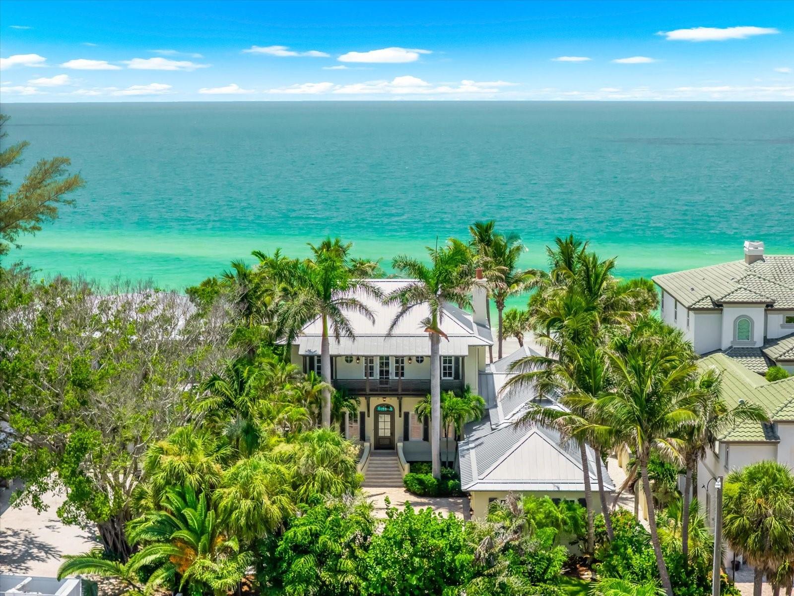 Under contract-accepting backup offers. Welcome to one of the Gulf Coast's most extraordinary beachfront estates, an exceptionally private waterfront retreat positioned on an oversized 80 x 240 Gulf-front homesite in the highly sought-after Town of Belleair Shore. Offering approximately 80 feet of combined Gulf and beachfront frontage, this gated residence presents an extraordinary opportunity to own one of the area's premier luxury properties where timeless architecture, exceptional craftsmanship, and an unmatched coastal setting come together.
Built in 2010 and encompassing approximately 3,923 square feet of refined living space, the residence is thoughtfully designed to maximize breathtaking panoramic Gulf views while creating an effortless connection between indoor and outdoor living. Soaring cathedral and vaulted ceilings, rich wood flooring, crown molding, custom millwork, ship lap ceilings, solid wood cabinetry, remote shades, stone countertops, expansive living spaces, and walls of glass create interiors of understated elegance and enduring style.

The main level showcases an elegant foyer, spacious great room with a gas fireplace, formal dining area - overlooking the resort style pool and Gulf of America, executive study, and a beautifully appointed chef's kitchen featuring premium appliances, natural gas cooking, solid surface countertops, abundant custom cabinetry, butler’s pantry, low bar with 3-designer pendant lighting and generous preparation space designed for both intimate gatherings and large-scale entertaining.

The first-floor primary suite serves as a private sanctuary overlooking the Gulf, French doors open onto a private terrace overlooking the pool & Gulf, complete with an expansive custom built walk-in closet and luxurious en-suite bath. Upstairs, three additional guest suites, two full bathrooms each with walk-in closets, an expansive Gulf-facing balcony offering spectacular sunset views from each of the three guest bedrooms stretching across the horizon, are complemented by a spacious loft - opens to a covered balcony and an expansive Gulf-facing balcony offering spectacular sunset views stretching across the horizon. Two laundry closets - one for each level. Exterior pool bath powder room, remote patio screen enclosure.

Designed for effortless coastal living, the outdoor experience is equally exceptional. The resort-style setting includes a heated spa, illuminated salt pool, covered outdoor living areas, outdoor kitchen, multiple balconies, lush mature landscaping, irrigation, professional landscape lighting, and direct access to the pristine white sands of Belleair Shore. A concrete seawall further enhances the property's waterfront improvements.

The oversized gated property offers exceptional privacy while remaining moments from Belleair Country Club, area marinas, fine dining, boutique shopping, and the world-renowned beaches of Florida's Gulf Coast. Residents also enjoy access to Belleair Shore's private resident beach amenities.

A spacious three-car side-entry garage, metal roof, tankless water heater, natural gas service, security system, and numerous premium appointments complete this remarkable residence.

Rarely does a property combine this level of privacy, beachfront frontage, architectural character, and premier location into one exceptional offering. This is Gulf-front living at its finest.