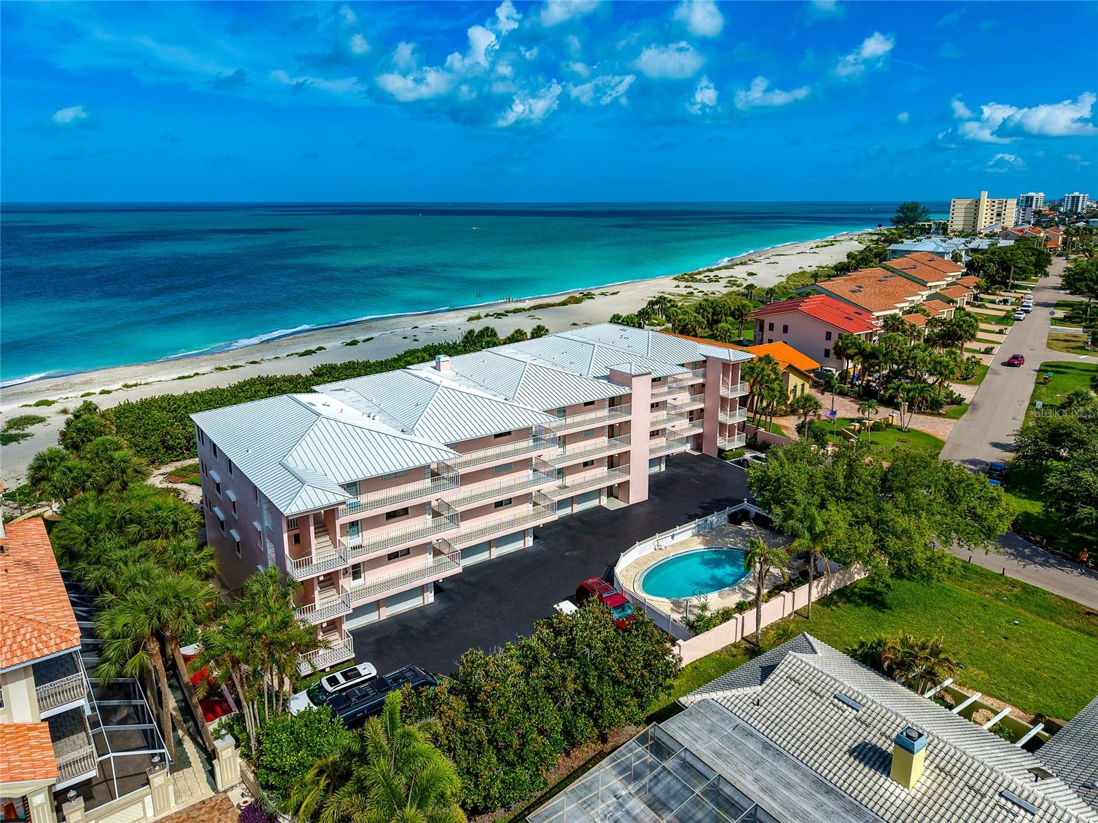 THIS IS THE ONE! A beach front opportunity to live on the Island of Venice! Rarely available in the Bermuda Sunset Condominium Association and perfectly positioned on Golden Beach, this beautifully updated second-story condo is one of only 12 condos, it offers breathtaking panoramic views of the Gulf waters and private beach access just steps from your door. Featuring 3 bedrooms and 2 full bathrooms, this coastal retreat combines timeless beachfront charm with modern hurricane-ready upgrades for peace of mind and effortless living. (Note: no damage sustained from recent hurricanes Ian, Helene or Milton). Major improvements include updated flooring, the thoughtfully renovated kitchen (2015), complemented by updated LG appliances (2019), creating an inviting space for entertaining and everyday living.  Hurricane impact windows (2019), hurricane impact glass sliders with remote-control screens (2022), and a hurricane impact entry door (2023), providing both security and energy efficiency. The spacious screened-in lanai/balcony is the perfect place to enjoy morning coffee, stunning sunsets, and refreshing Gulf breezes year-round. Additional conveniences include tandem 2-car parking with room for vehicles or a golf cart. The garage door is also updated with keypad and remotes. Whether you are seeking a full-time residence, or seasonal getaway, this exceptional Gulf-front condo offers the rare chance to own in a desirable beachfront community where units seldom become available. SOME FURNISHINGS INCUDED: All Bedroom Furniture, All Lanai Furniture, Living Room Sectional.