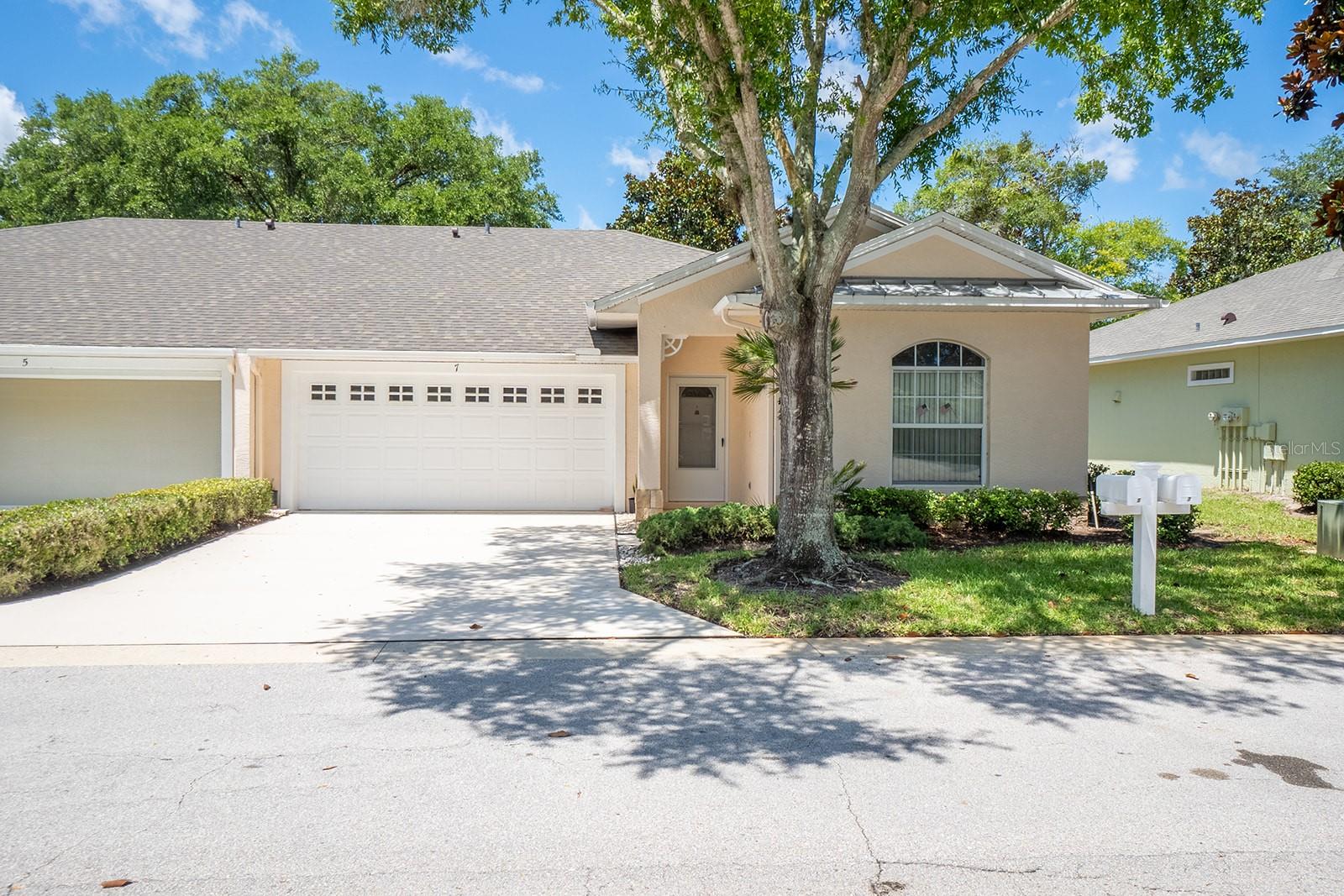 Location! Location!  Two minutes walk to Island Walk shopping center.  Across the street from the community pool.  Maintenance free living makes life easy.  Three bedroom unit with double garage.  Split plan with primary bedroom and ensuite at the front of the unit and two bedrooms and second bathroom at the back.  Private backyard. Sunny florida room at the back which catches all the sun.  Residents have access to a private community pool.  All exterior maintenance, common ground maintenance and pest control covered by the HOA making life stress free,