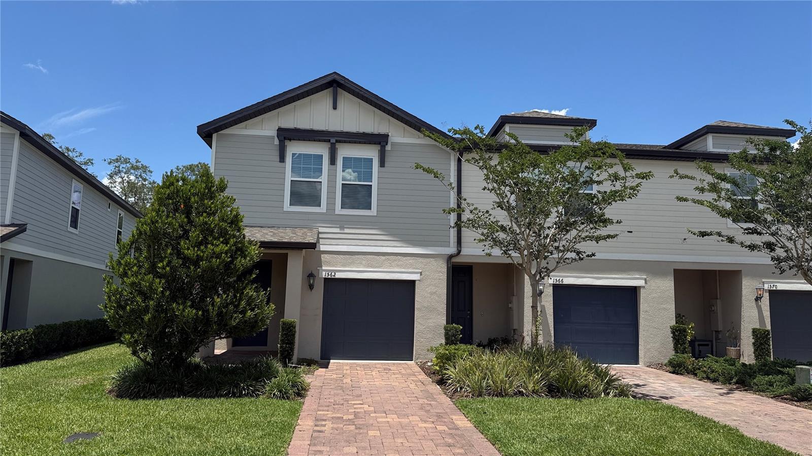 Welcome to this like-new 2022 Craftsman-style END-UNIT townhome in the heart of highly desirable Seminole County! This beautifully maintained 3-bedroom, 2.5-bath home offers the perfect blend of modern design, energy efficiency, and low-maintenance living. As an end unit, the home is filled with abundant natural light and offers additional privacy along with extra green space to enjoy—without the upkeep, as HOA lawn maintenance is included. Step inside to a bright open-concept floor plan featuring tile flooring throughout the main level, creating a clean and modern feel. The designer kitchen is a true centerpiece, showcasing white color 42” cabinets, granite countertops, stainless steel appliances, a large prep island with seating, stylish backsplash, and generous pantry storage—perfect for everyday living or entertaining guests. Upstairs, a versatile loft provides the ideal space for a home office, reading nook, media area, or playroom. The spacious primary suite offers a large walk-in closet and a private en-suite bath with dual vanities and a walk-in shower, while the split-bedroom layout adds comfort and privacy for family or guests.Enjoy relaxing on your private patio overlooking peaceful green space, perfect for morning coffee or evening unwinding. Built with energy-efficient features including Low-E windows, LED lighting, efficient appliances, and multi-speed HVAC for year-round comfort and savings. Community amenities include a dog park, playground, walking trails, putting green, yoga lawn, picnic areas, and more. Conveniently located near top-rated Seminole County schools, shopping, dining, SR 417, UCF, parks, and the Cross Seminole Trail—this move-in-ready home truly checks every box!
Note: Some of the pictures are showing the virtual staging of the unit and the furnitures and decorative items are not included to the listing