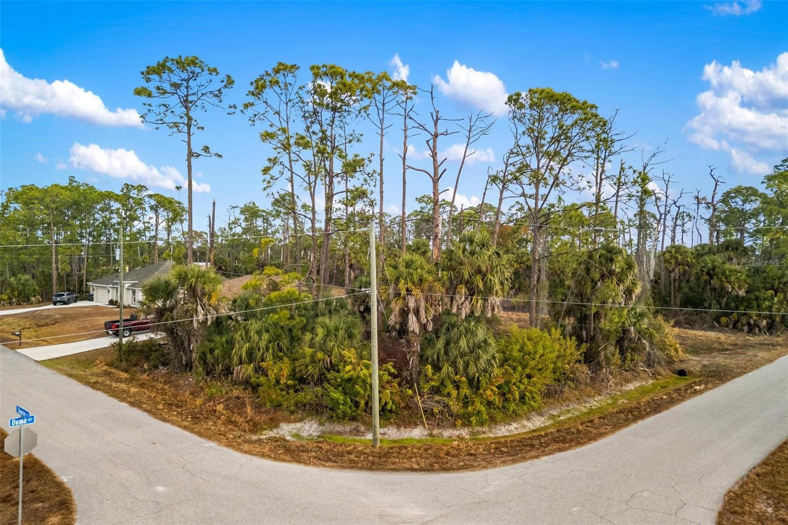 Opportunity awaits on Duma Way! This corner residential lot is located in one of Nort Port's fastest growing areas, surrounded by newer homes and ongoing development. No HOA! No CDD! NOT in a flood zone. Just the freedom to build your way. Convenient access to I75 makes commuting north to Sarasota or South to Fort Myers simple and efficient. The property is also just minutes from the new Sarasota Memorial Hospital campus currently under development! A major addition that continues to drive growth and long-term value to the area. Enjoy proximity to shopping, dining, schools, Warm Mineral Springs, Wellen Park and the Gulf Beaches all while tucked in a quiet residential setting.  Whether you're ready to build your Florida dream home or secure land in a growing corridor, this corner lot checks the boxes. Bring your builder!  The future of North Port is underway.