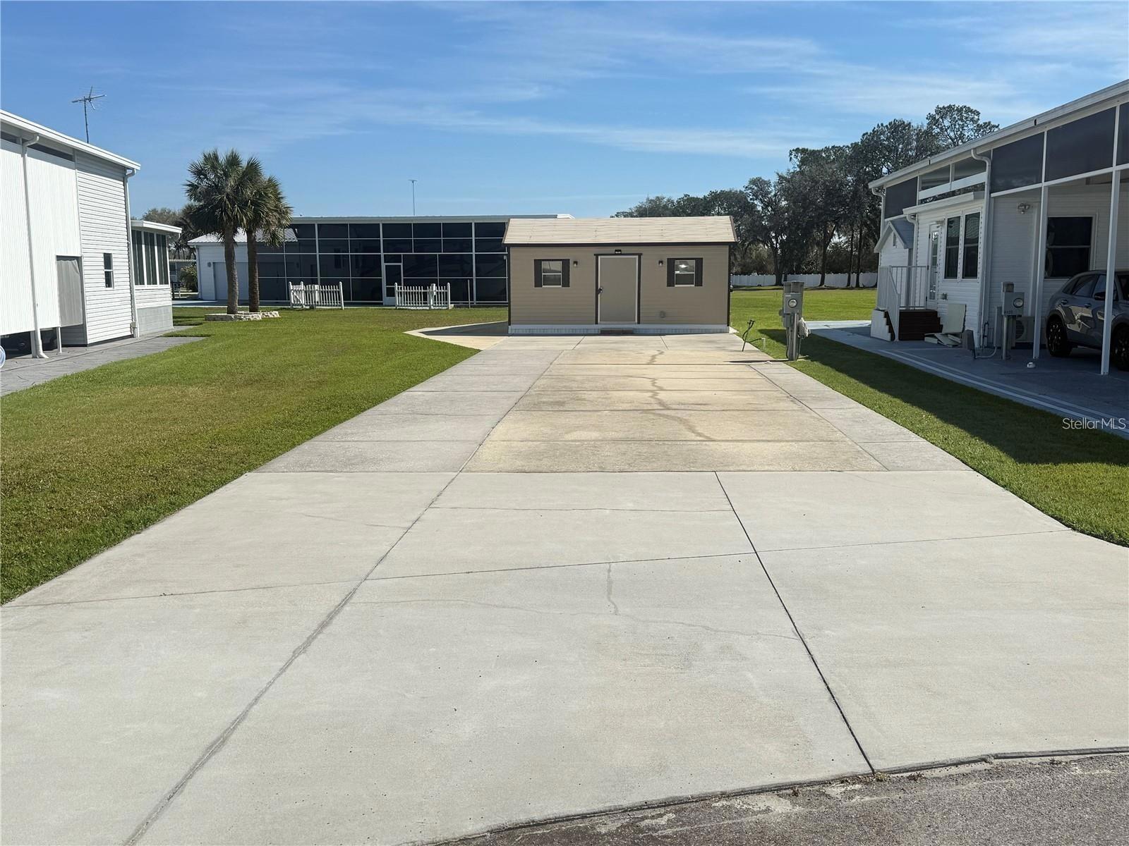 Discover a rare opportunity to secure an oversized Class A motorhome lot tucked away on a quiet cul-de-sac in desirable Phase 1 of Mount Olive Shores.

This extra-large lot features an expansive concrete slab designed to accommodate virtually any size Class A motorhome, complete with full public utility hookups, including both 50-amp and 30-amp service. Whether you’re traveling seasonally or planning extended stays, the infrastructure is already in place for immediate enjoyment.

Adding significant value is the nearly new, fully insulated 10’ x 20’ shed, thoughtfully upgraded and highly functional. It includes a new washer and dryer, utility sink, InstaHot water heater, and a roll-up garage door—ideal for secure golf cart storage or additional equipment.

With HOA approval, you have the option to expand your outdoor living space by adding a 10’ x 20’ porch or screened enclosure. The lot also provides flexibility for future development, including the potential to install a manufactured home and RV port, allowing you to tailor the property to your long-term vision.

Mount Olive Shores is a gated, deed-restricted community designed exclusively for Class A motorhome owners. Ownership or Lease of a Class A motorhome is required your first year of residency, preserving the integrity and lifestyle of the neighborhood.

Residents enjoy a welcoming atmosphere and exceptional amenities, including a brand-new 5,000-square-foot heated and cooled Community Center. This impressive facility features:
 • Full kitchen
 • Regulation shuffleboard and pool tables
 • Dart board and arcade games
 • Dedicated card room and library
 • Vending area
 • Covered BBQ lanai

A robust calendar of seasonal events—Bingo, karaoke nights, potluck dinners, holiday celebrations, and social gatherings—creates constant opportunities to connect and engage.

Ideally located just minutes from I-4, the community provides convenient access to major shopping centers, top-tier medical facilities, and both Tampa and Orlando International Airports. Central Florida’s world-class attractions are less than an hour away.

This is more than a lot—it’s a strategic entry into one of Central Florida’s most established Class A motorhome communities.
