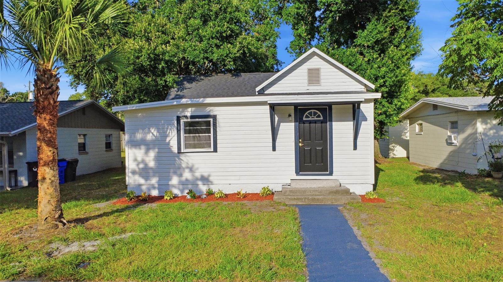 Completely Remodeled Gem in the Heart of St. Cloud - this beautifully remodeled 2-bedroom, 1-bath home offering 1,095 sq ft of thoughtfully updated living space in one of St. Cloud's most convenient and sought-after locations. From top to bottom, this home has been done right — move in, unpack, and enjoy. Step inside to discover a fresh, modern interior where every detail has been addressed. The layout flows naturally into a spacious enclosed porch under air — perfect as a bonus living area, home office, or everyday Florida room that gets used year-round. Out back, you'll find a covered carport tucked in the rear of the property, keeping your vehicle protected from the Florida sun and afternoon storms without sacrificing your front yard. Located just minutes from St. Cloud Elementary, St. Cloud Middle School, and St. Cloud High School, as well as highly-rated Canoe Creek K-8 — all part of the Osceola County School District. Proximity to schools also means proximity to parks, sidewalks, and the kind of established, walkable neighborhood that's hard to find at this price point. Beyond that, you're steps from everything St. Cloud has to offer. The vibrant downtown along New York Avenue features boutique shops and community festivals, and East Lake Tohopekaliga is just one mile away — offering boating, fishing, and stunning lakeside views. Lakefront Park, the marina, splash pad, and the monthly downtown market round out a lifestyle that's tough to beat. Whether you're a first-time buyer or an investor looking for a turnkey property in a high-demand location — this one checks every box. Schedule your showing today.