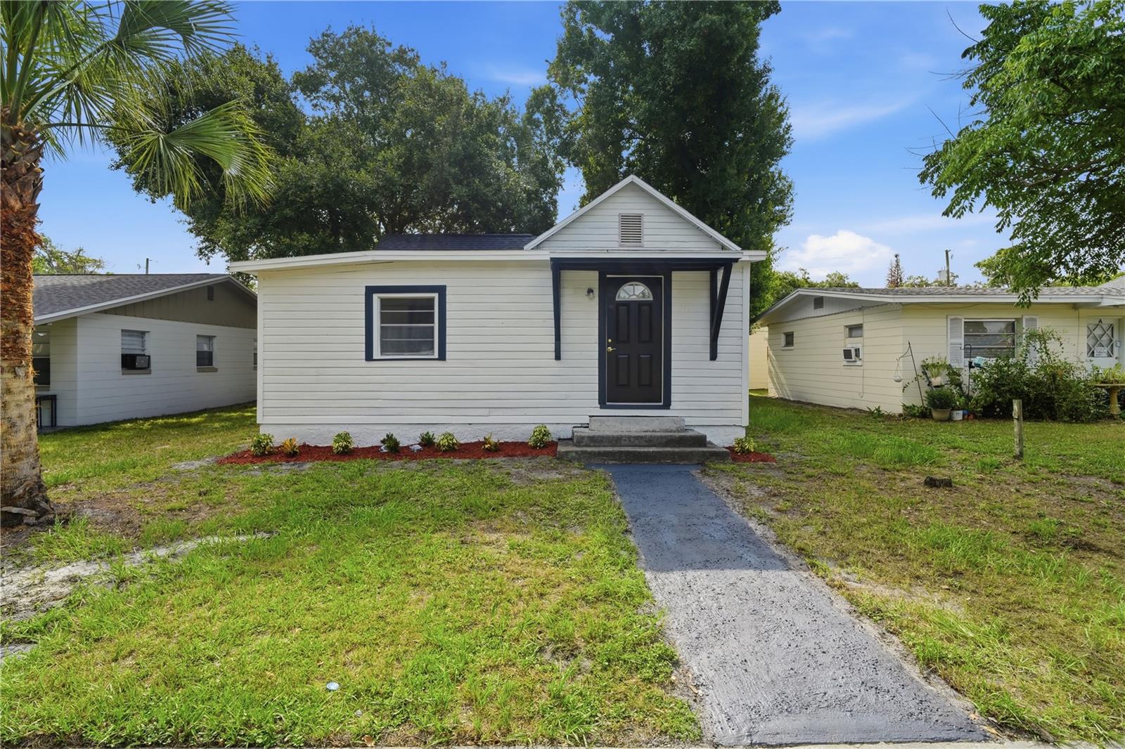 Completely Remodeled Gem in the Heart of St. Cloud - this beautifully remodeled 2-bedroom, 1-bath home offering 1,095 sq ft of thoughtfully updated living space in one of St. Cloud's most convenient and sought-after locations. From top to bottom, this home has been done right — move in, unpack, and enjoy. Step inside to discover a fresh, modern interior where every detail has been addressed. The layout flows naturally into a spacious enclosed porch under air — perfect as a bonus living area, home office, or everyday Florida room that gets used year-round. Out back, you'll find a covered carport tucked in the rear of the property, keeping your vehicle protected from the Florida sun and afternoon storms without sacrificing your front yard. Located just minutes from St. Cloud Elementary, St. Cloud Middle School, and St. Cloud High School, as well as highly-rated Canoe Creek K-8 — all part of the Osceola County School District. Proximity to schools also means proximity to parks, sidewalks, and the kind of established, walkable neighborhood that's hard to find at this price point. Beyond that, you're steps from everything St. Cloud has to offer. The vibrant downtown along New York Avenue features boutique shops and community festivals, and East Lake Tohopekaliga is just one mile away — offering boating, fishing, and stunning lakeside views. Lakefront Park, the marina, splash pad, and the monthly downtown market round out a lifestyle that's tough to beat. Whether you're a first-time buyer or an investor looking for a turnkey property in a high-demand location — this one checks every box. Schedule your showing today.