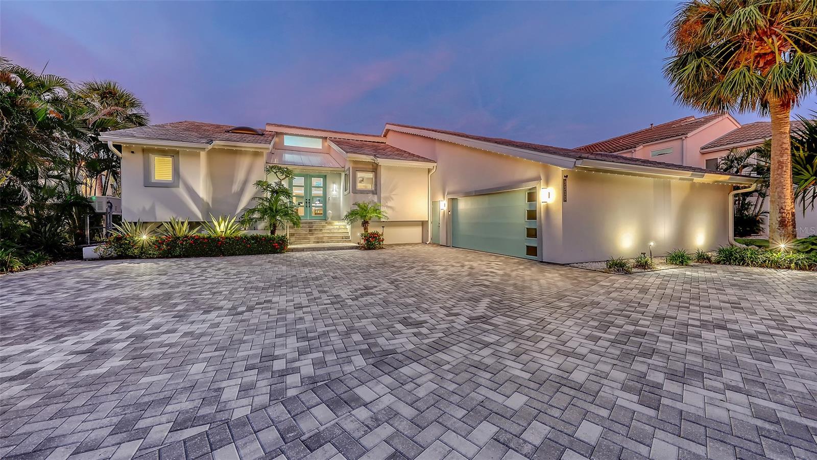 Artfully Curated, Fully Reimagined Lakefront Estate in Bay Isles

This is not just a home—it’s a curated piece of art. Set behind the exclusive 24-hour guarded gates of the Longboat Key Club in the sought-after Bay Isles community; this residence has been completely reimagined from the ground up. Taken down to the studs and rebuilt with all-new electrical, plumbing, HVAC, and impact-rated windows and doors, this one-level home offers nearly 3,000 square feet of effortless luxury.

Situated on an expansive 16,000+ square foot lot at the end of a private cul-de-sac, the property enjoys unobstructed views of a tranquil lake where swans glide and otters play. From nearly every room, you’ll feel as if you’re floating on a private yacht, surrounded by nature and beauty, with no neighboring homes in sight—just shimmering water and spectacular sunrises.

The tropical grounds were designed by a local landscape architect, featuring rare and exotic trees, custom landscape lighting, and garden paths that glow under nightfall. A newly updated pool area with travertine stone, an outdoor kitchen, and hurricane-impact screen enclosure creates an idyllic retreat. Perimeter accent lighting ‘Trimlite’ along the roofline adds an architectural glow after dark.

Inside, wide 9-inch white oak hardwood planks run throughout the home. The state-of-the-art kitchen is a showpiece,  Devittori custom designed and installed cabinets and outfitted with Thermador’s finest: a steam oven, coffee center, warming drawer, wine fridge, and built-in appliances—all surrounded by exquisite countertops and a waterfall island. The ambiance is elevated even further with Hue smart lighting systems throughout the home, allowing you to set the perfect mood in every room.

Every inch of this residence was thoughtfully planned and executed with uncompromising attention to detail. A newly installed 3-zone HVAC system (2024), whole house generator, spacious two-car garage with epoxy floors, dedicated storage, and a 220V EV charging station. Every bathroom and space within the home has been finished with the highest level of craftsmanship and elegance.

Enjoy the unmatched lifestyle of Bay Isles, with deeded access to the private Bay Isles Beach Club, and the convenience of nearby Publix, dining, banking, and wellness amenities—all just moments from your front door.

This is a rare opportunity to own a truly one-of-a-kind home on Longboat Key