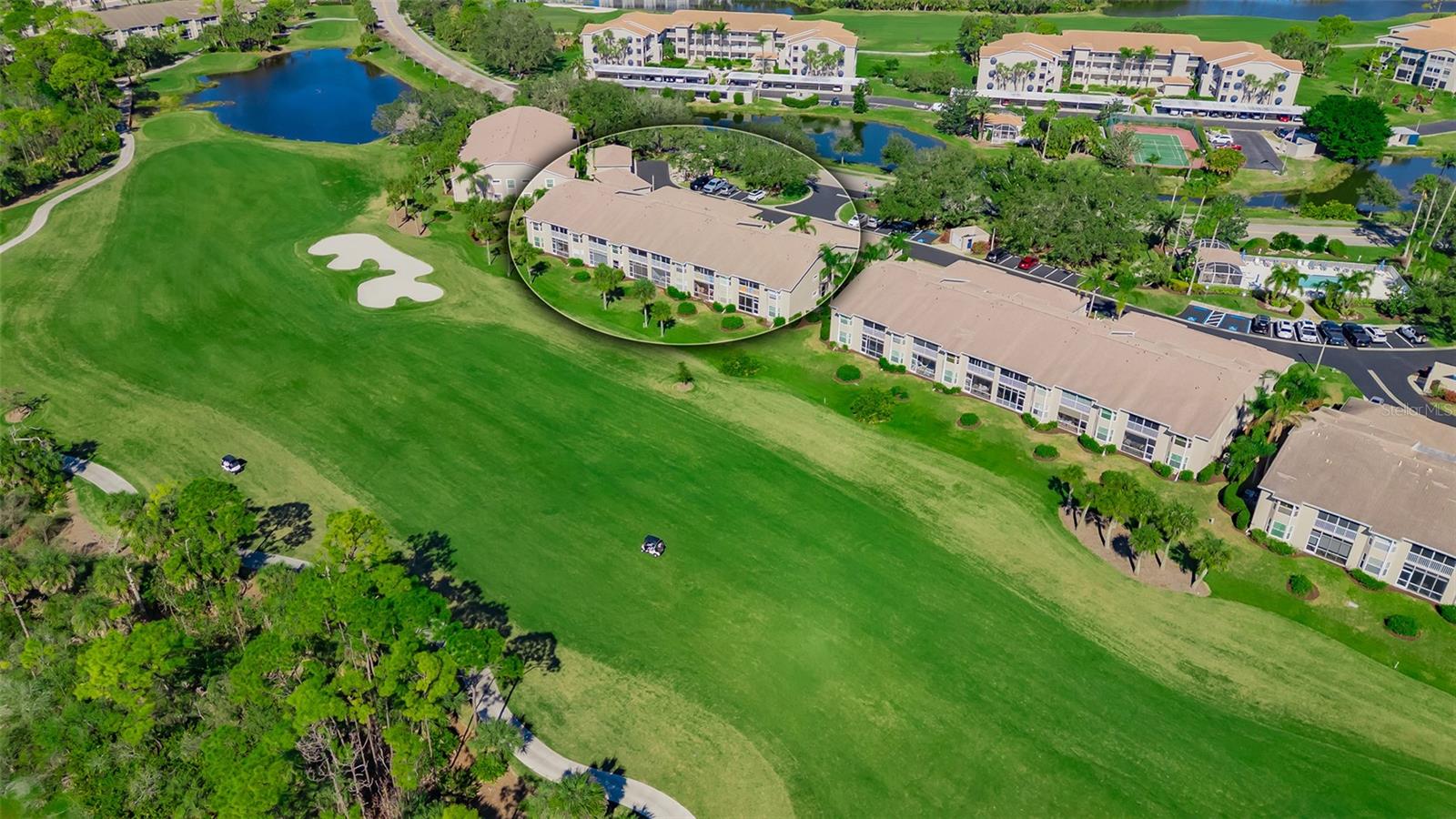Don't miss this great chance at an updated Abbey Condo with its top shelf views of the 4th fairway to the green and lake!  New roofs installed in 2026! The sunny and bright glassed-in lanai for your daily sunsets boasting this corner unit, 2 bedrooms and Den with updated kitchen and baths and 6 impact windows!  Entering the home through the front lanai area you will find the updated kitchen with stainless steel appliances, a brand-new refrigerator in June '26, stylish quartz counters, engineered wood floors, backslash, large drawers for easy access and a bay window in the dinette area.  Large Primary suite with its own views of the course and lake and a slider to the lanai area, twin walk-in closets, updated tile throughout the Bath with modern glass walk-in shower and separate soaking tub, twin sinks.  Lovely Den with twin doors and the corner building impact window, additional doorway to guest quarters.  The guest quarters feature a modern shower bath along with its own walk-in closet. The open floor plan with its living/dining room combination has souring ceilings and functional dry bar for entertaining.  Laundry room offers side by side units and ample storage.  One-car garage with its pull-down stairs for additional storage. Partially furnished unit. Community pool nearby with a screened in area for entertaining and relaxing.  Stoneybrook of Sarasota, A premier member-owned country club is only a short distance from Siesta Key and offers easy access to shopping and borders the Legacy Trail. Ownership in Stoneybrook Golf and Country Club includes a completely updated 18 hole golf course in 2024, clubhouse and restaurant, Har-Tru tennis facility, well-equipped fitness center and additional club pool and spa.  Nestled between Downtown Sarasota and Downtown Venice.