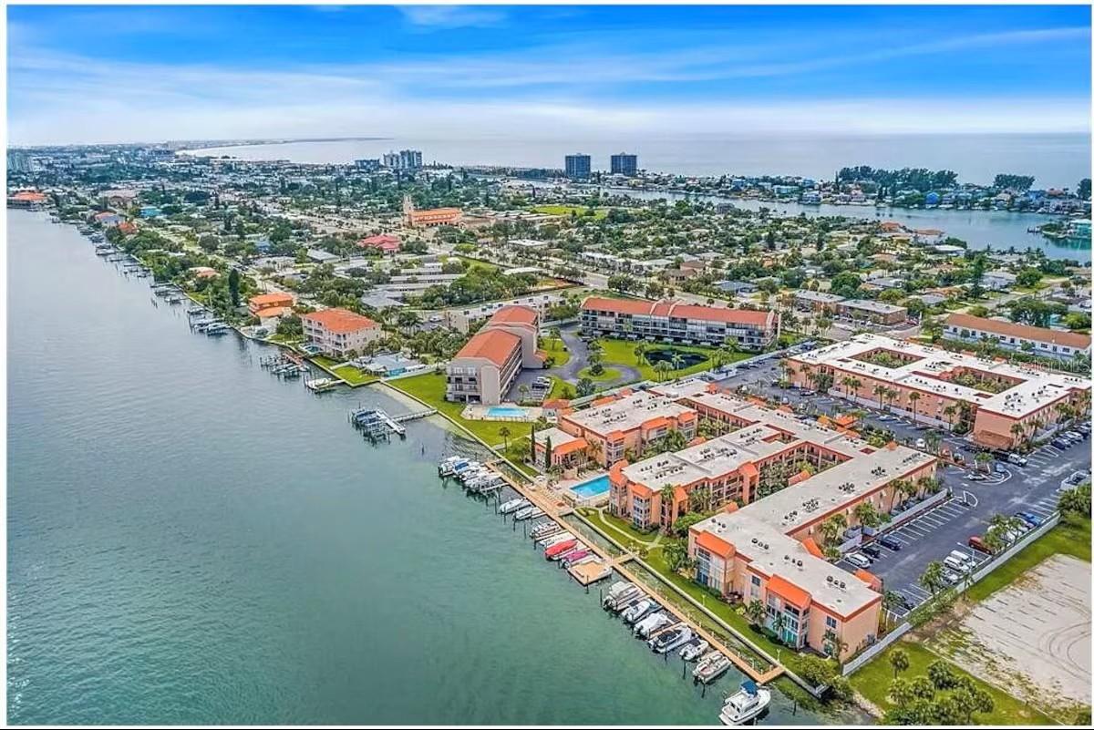 STEPS TO THE WATER! BOAT SLIPS! RARE OPPORTUNITY! Wake up to dolphins swimming along intracoastal waterways every single day — welcome to waterfront living at its most attainable. Tucked inside the sought-after gated community of Boca Shores, this one-bedroom, one-bath retreat delivers the kind of lifestyle most people only dream about. Whether you're casting a line off the dock, paddling out on your kayak, or simply sipping your morning coffee while watching boats drift by, this home was made for those who live for the water. The unit has been thoughtfully refreshed from top to bottom. Impact-rated windows, doors, and sliders now protect the home, while inside you'll find a sleek, updated kitchen featuring quartz countertops and stainless steel appliances. New electric panel, water heater, and updated HVAC mean the big-ticket items are already handled. Tile flooring runs seamlessly throughout the entire unit. Step out onto your private lanai and take in the gorgeous Intracoastal views — your own front-row seat to Florida's waterfront scenery. The condo fee already covers building insurance, exterior maintenance, cable, internet, water, sewer, and trash — simplifying ownership considerably. Community amenities include a heated pool perched along the Intracoastal, a clubhouse with fitness facilities, on-site laundry, a car wash station, kayak and bicycle storage, a fishing dock with cleaning station, and boat slip leases available at just $91 per month. Two pets up to 35 pounds are welcome. Beautiful white sand beaches await close by, with St. Pete Beach, Pass-A-Grille, downtown St. Petersburg, and Gulfport's restaurant and arts scene all within easy reach, as are both St. Pete/Clearwater and Tampa International airports.