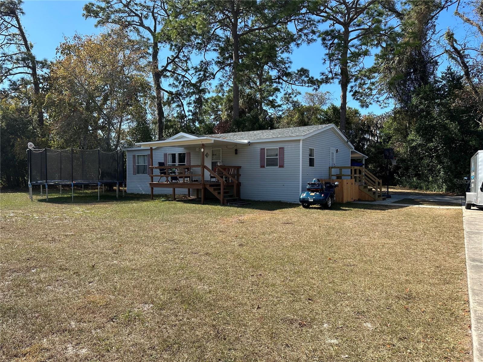 Must See!!! This move in ready home located on a very private fenced-in 1/2 Acre lot. This is a turn key property, move right in, many updates including kitchen and baths, flooring appliances, plumbing and electrical. Large master suite with shower and tub, inside laundry, plenty of storage. Kitchen has breakfast bar, large island as well as work/desk area. This lot has plenty of privacy with a fence all around as well as mature landscape in the back. Plenty of concreted parking space, as well as a 2 car carport.