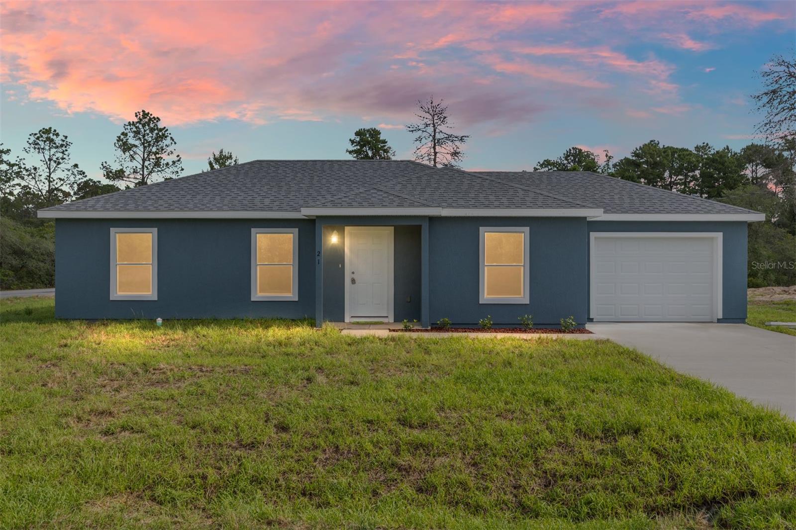Under Construction. Welcome to the beautifully crafted “Legacy” model by Michael Alan Homes! This brand-new construction offers 3 bedrooms, 2 bathrooms, and a 1-car attached garage, perfectly situated on a desirable corner lot in Ocklawaha. Step inside to an open-concept floor plan featuring soaring cathedral ceilings and a split-bedroom layout for added privacy. The home is finished with luxury vinyl plank flooring throughout, complemented by granite countertops in both the kitchen and bathrooms. The modern kitchen includes a full stainless steel appliance package and overlooks the spacious living and dining areas—ideal for everyday living and entertaining. Additional highlights include an inside laundry room and quality finishes throughout. Don’t miss your opportunity to own this brand-new home!