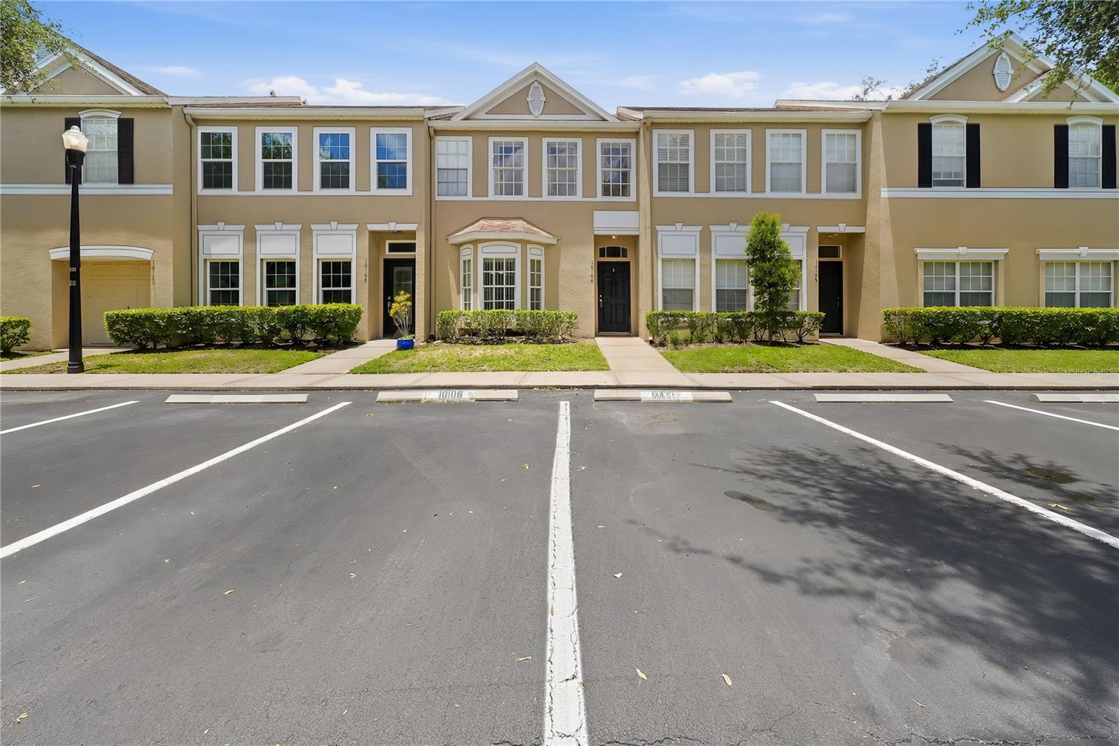 Seller is offering assistance with buyer closing costs! Welcome to this move-in-ready 3-bedroom, 2.5-bath townhome located in the desirable gated community of Trafalgar Square in Carrollwood. This home is ideal for first-time homebuyers, families, investors, or anyone seeking low-maintenance living in one of Tampa's most convenient locations.

Thoughtful upgrades include beautiful laminate flooring throughout the entire home. The open-concept living and dining area flows seamlessly into a covered Florida room with a spacious storage and utility room. Step outside to your private, fully fenced paver courtyard, creating the perfect space to relax, entertain, or enjoy Florida's beautiful weather.

The kitchen overlooks the main living area and comes complete with all major appliances. An interior laundry area with washer and dryer is included for added convenience. Upstairs, you'll find three generously sized bedrooms with abundant natural light and ample closet space, while the downstairs half bath is ideal for guests.

Residents of the gated Trafalgar Square community enjoy exceptional amenities, including a community pool, playground, and a scenic dock overlooking a picturesque 5+ acre pond. The HOA also provides outstanding exterior maintenance, including roof maintenance, exterior painting, exterior pressure washing, maintenance of all common areas, fence maintenance, and exterior pest control. The rear patio fences have recently been updated by the HOA, helping maintain the community's attractive appearance while providing homeowners with added peace of mind and reduced exterior maintenance responsibilities.

Ideally located just minutes from the Veterans Expressway, this home offers convenient access to Tampa International Airport, Downtown Tampa, shopping, dining, hospitals, parks, and highly rated schools. Nearby attractions include AMC Theatres (2 miles), Costco (4 miles), Sam's Club and Whole Foods Market (5 miles), ZooTampa, multiple golf courses, Busch Gardens, Adventure Island, and a wide variety of family-friendly entertainment, all within a short drive.

Don't miss this opportunity to own a beautifully maintained home in one of Carrollwood's most convenient gated communities. Schedule your private showing today!