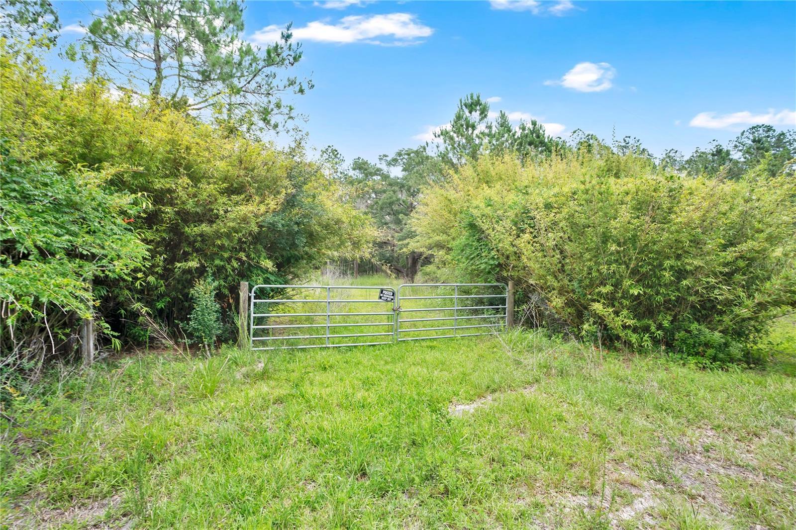 Discover the possibilities with this beautiful 16.39-acre residential parcel in Citra, Florida. Surrounded by mature pine trees and natural Florida beauty, this expansive property offers privacy, space, and endless potential for your dream home, family compound, mini farm, or weekend retreat. Existing well and septic are located on site (condition/functionality unknown), adding to the property's future potential. With plenty of room for recreation, animals, gardens, or additional improvements, this is a rare opportunity to own a large tract of land in a peaceful rural setting while still being conveniently located to Ocala, Gainesville, and surrounding areas. Close to Gooski Prairie and the Ocala National Forest. Buy now and build in the future. Property contains a mixture of hardwoods and offers plenty of room to garden. Great location to make a wet weather pond for water source. Property has 2 existing wells and septic's. Seller will consider all reasonable offers. Bring your vision and make this slice of Old Florida your own.