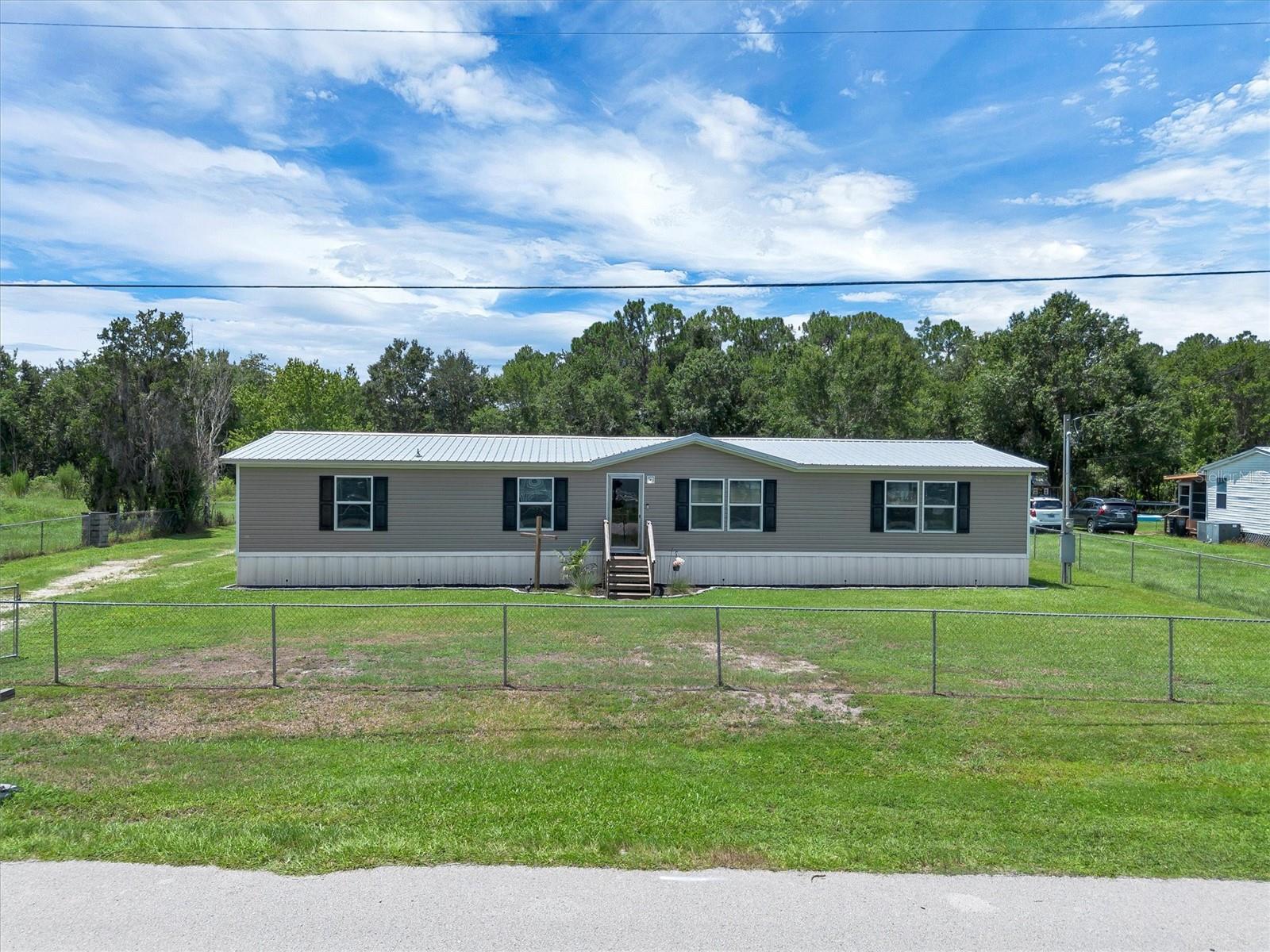 Welcome to your own slice of country paradise in the heart of Polk City! Situated on .84 acres, this beautifully maintained 4-bedroom, 2-bath home offers the perfect combination of comfort, functionality, and outdoor living. The spacious split-bedroom floor plan features an open living area that flows seamlessly into the kitchen and dining space, making it ideal for both everyday living and entertaining.

Recent updates include a new refrigerator and dishwasher, while the durable metal roof provides lasting peace of mind. Step outside to your private backyard retreat featuring an above-ground pool, a fully fenced yard, and a storage shed for all your tools, toys, or hobbies. With nearly an acre of land, there’s still plenty of room to garden, play, or simply enjoy the peaceful surroundings.

Conveniently located with easy access to I-4, you’ll enjoy the best of both worlds, quiet country living with an easy commute to Lakeland, Tampa, and Orlando. Don’t miss this opportunity to own a move-in-ready home with space to live, relax, and grow. Schedule your private showing today!