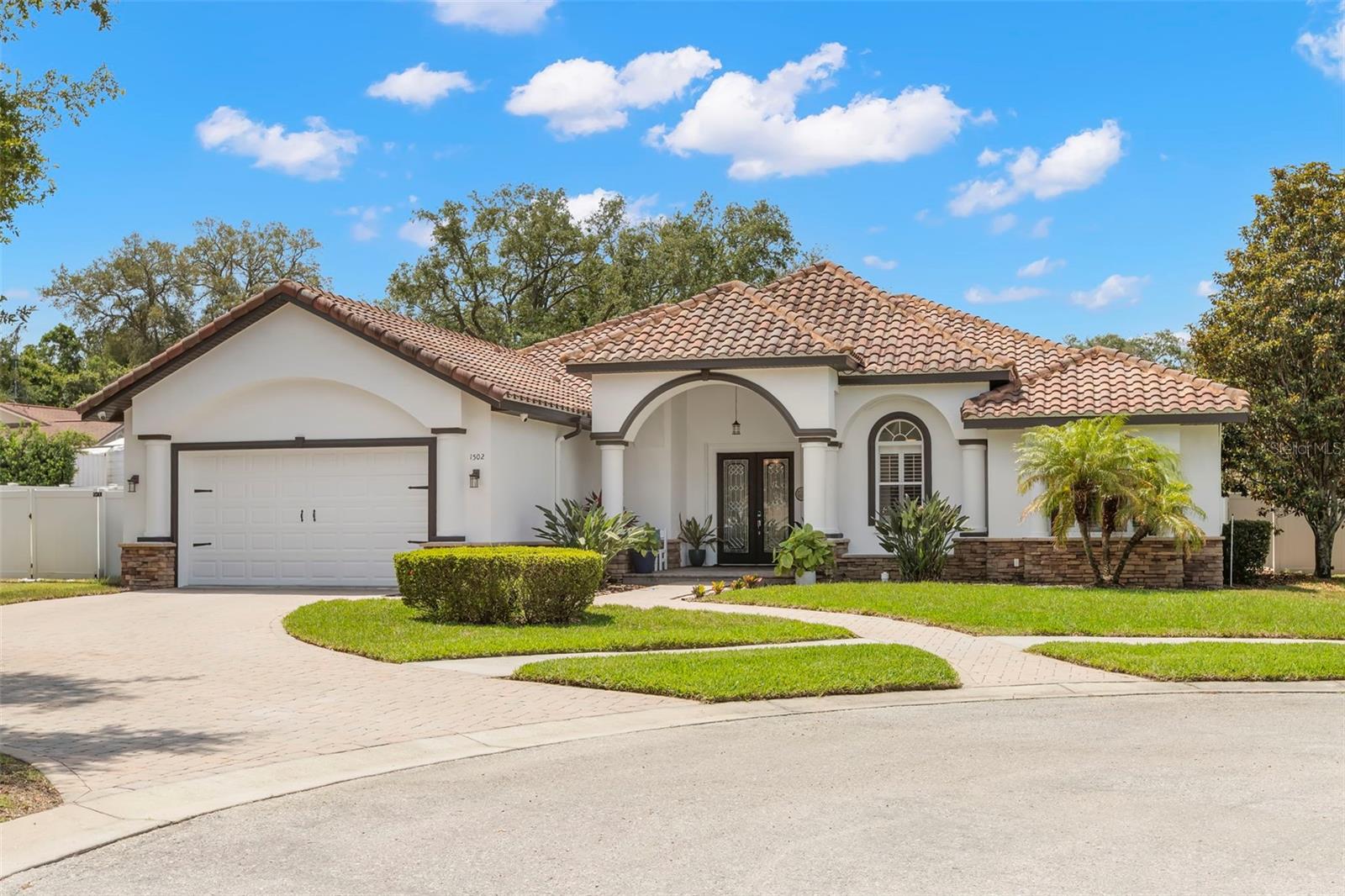 Welcome home!  This stunning 3 Bedroom / 3.5 Bathroom + Office, executive-style residence (3,034 sq ft) sits on a large pie-shaped cul-de-sac lot — prime Tarpon Springs location minutes from Fred Howard Park and beaches. The thoughtfully laid-out split floorplan places the oversized primary suite on one side (with extended study area that can serve as a nursery, 2nd office or a custom Closet space (has custom closet organizing area in place today) .... while 2 guest bedrooms split by 1 full bathroom are privately located on the opposite end of the home. The Kitchen, Living room, Dining space, and dedicated home office anchor the center of the home for effortless flow. Key features:  Oversized primary bedroom with extended study area / custom closet, 1 full bath accessible from the pool deck. Buyers will fall in love with the large pavered pool deck with walk-in “BEACH ENTRY" HEATED POOL, Pebbletec finish, and salt-water filtration, FULL HOME SOLAR PANELS (installed Fall 2022) for monthly energy savings, Tankless water heater, gorgeous tile roof, hurricane shutter system, Home Office with custom shelving; zoned irrigation; freshly painted exterior & new landscaping, Huge backyard on a cul-de-sac lot; Flood Zone X — no flood insurance required.  This turnkey home blends luxury, energy efficiency and indoor-outdoor Florida living — perfect for entertaining and living the N Pinellas lifestyle.  Close to downtown Tarpon Springs, shopping, Innisbrook Golf Club, and local parks and beaches.  This one will not last long- make an appt quickly!