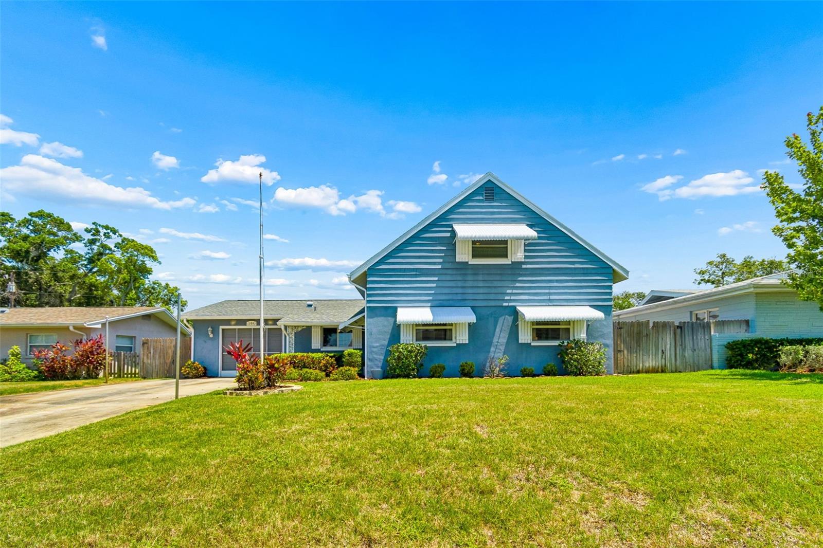 Location, location! This is the one you've been waiting for, ideally just minutes from award-winning Gulf beaches, premier shopping and top-rated schools, all within visiting or biking distance, this exceptional pool home delivers the Florida lifestyle you've been dreaming of. Offering 1,920 square feet with three bedrooms plus a spacious bonus room that easily functions as a fourth bedroom, two baths, and an oversized first-floor primary suite expanded for exceptional comfort and relaxation. The beautifully updated kitchen (2020) features soft-close cabinetry, all-new appliances and a smart range, blending style with modern convenience. Major updates provide peace of mind, including a new roof (2023), two new air-conditioning systems (2023), new pool pump and filter (2023), spa heater (2023), garage door (2020), hurricane-impact upstairs windows, newer downstairs windows with shutters and an updated downstairs bath. Enjoy abundant storage, a screened garage that invites in the refreshing Gulf breezes, and a private backyard designed for effortless entertaining with low-maintenance AstroTurf that stays beautiful year-round. Best of all, this no-HOA, no-deed-restrictions, no-flood-zone property gives you the freedom to keep your boat at home, with the Intracoastal boat ramp just one mile away. This isn't just a home, it's the Florida lifestyle you've been waiting for.