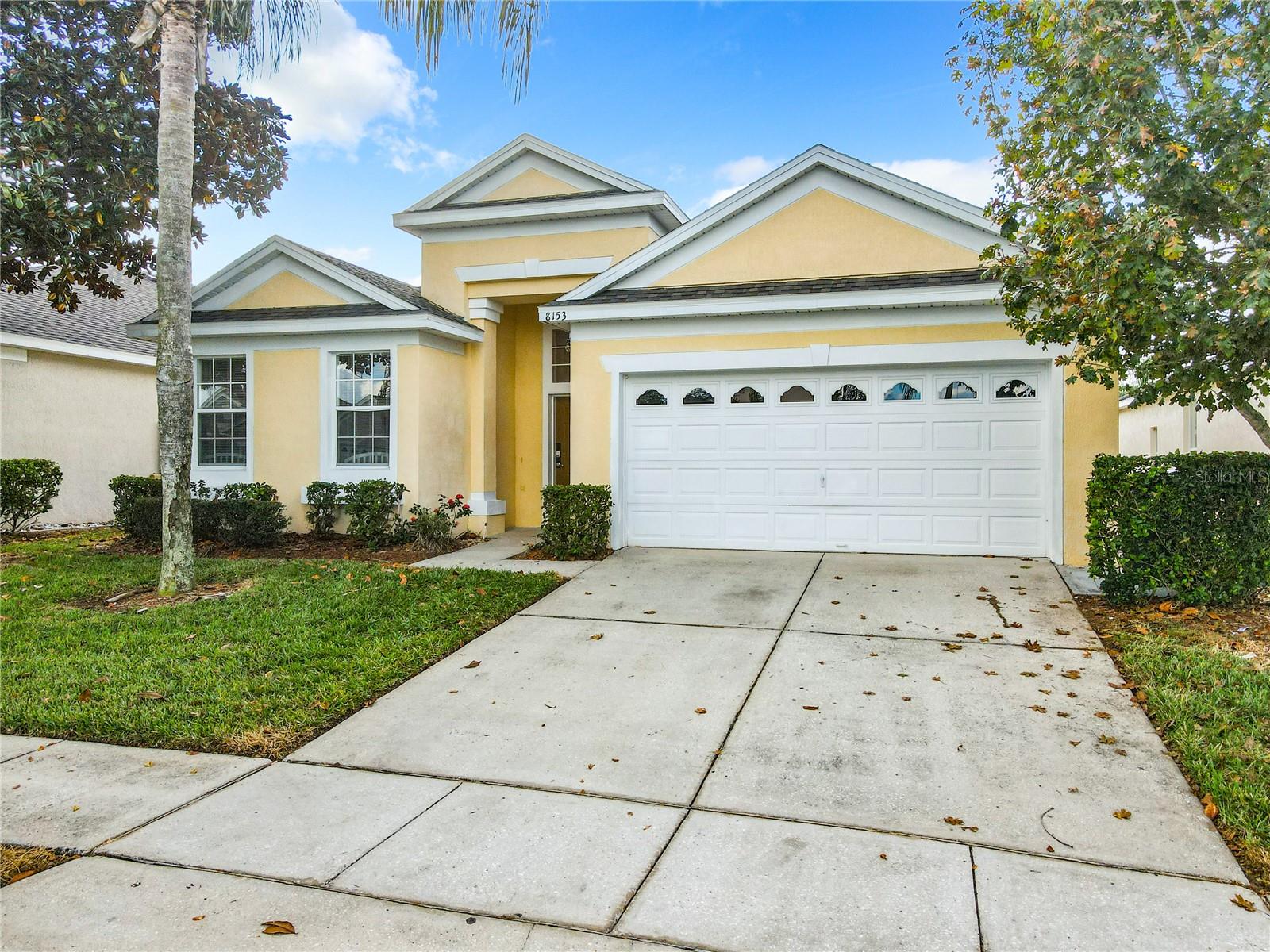 Windsor Palms is one of the most established and popular resort communities for visitors to Orlando. Guard gated and offering great amenities such as clubhouse with resort pool and fitness center, tennis courts, guard gated entry restaurant, security, playground and more.  8153 Fan Palm offers 4 bedrooms 3 baths with private lanai and pool area. Great eat in kitchen area is open to the family room/dining room for a great open concept feel. Separate games room in the garage allows for hours of fun, or just hanging out. The private pool area is a great place to relax after a day at the parks! The owners have replaced the roof (2020) the A/C 2021, and replaced the appliances with stainless steel (2023) along with new living room furniture in 2022. Just 4 miles from the gates of Disney and tons of shopping/restaurants.  In addition to the 24/7 guard gated entry, the HOA offers  the following items included in your monthly dues: internet, fiber-optic cable, daily trash service, community pool with splash pad, chill bar and grill at the pool, tennis courts, playground, fitness center, movie theater, and arcade. This home has been meticulously maintained and is ready for you and your guests to enjoy!