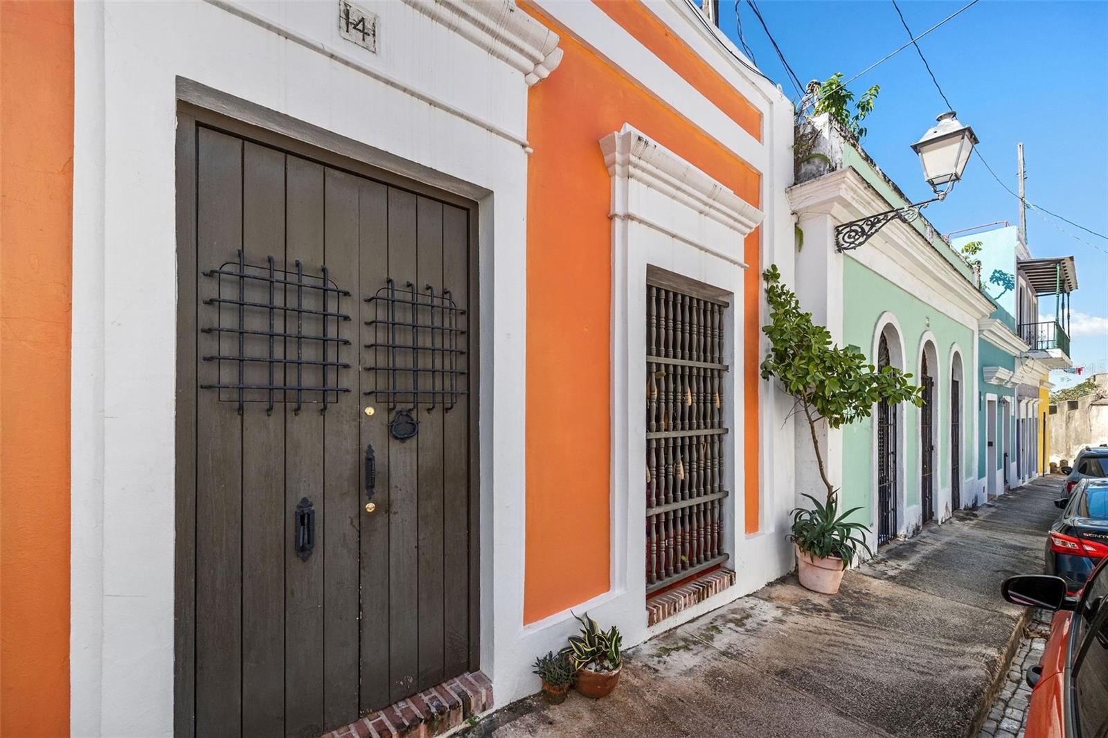 OLD SAN JUAN, step back in time and immerse yourself in the rich history and culture of Old San Juan, with this stunning colonial house for sale! This beautiful property, built in the late 1780s, has been carefully restored and preserved to retain its original charm and character. Located in the heart of the old city, this property offers the perfect blend of old-world charm and modern convenience.
The house is a three-level home, having 3,500 square feet, featuring three bedrooms, three bathrooms, powder room, two living areas, dining, kitchen, family, office room, storage, patio, two terrace spaces at the second level and roof terrace. The lot has an area of 151 square meters. As you enter, you'll be greeted by a grand foyer that leads to a spacious living room with high ceilings and traditional Spanish marble tile floors. As you step into the zaguan of this stunning colonial home, you'll feel like you're being transported back in time to a bygone era of grandeur and elegance. The zaguan, with its soaring arches serves as a dramatic entryway, leading you from the bustling street outside to the serene and private living area within. Making your way through the zaguan, you'll notice the intricate details and craftsmanship that are hallmarks of colonial architecture. The tiled floors, meticulously laid by skilled artisans, create a sense of flow and continuity, leading you deeper into the heart of the home. The high ceilings, adorned with decorative moldings and carvings, lend a sense of greatness and importance to the space. The formal dining room is perfect for hosting dinner parties, with plenty of space for family and friends to gather around the table. The fully equipped kitchen has been updated with modern appliances, while still retaining the traditional style of the home. The second level has three spacious bedrooms, each with its own unique character and charm, and full bathrooms in addition to two terrace spaces at each end of this level. Gazing upon the historical masonry wall located in the lower level of the patio area, you will be mesmerized by the texture and color of the wall, along with the elaborate patterns of the bricks, telling the story of colonial times and cultural heritage. The warm sun and gentle breeze from the mango tree add to the peaceful ambiance, allowing you to fully appreciate the beauty of the architecture and the natural surroundings. Step outside to the expansive rooftop terrace, where you can enjoy stunning views of the city and the ocean beyond. The terrace is the perfect place to relax and unwind, with ample space for outdoor dining and entertainment. Located at the most desirable area of Sol Street, in the heart of Old San Juan, this property is just steps away from world-class restaurants, boutique shops, and historical landmarks. Whether you're looking for a vacation home or a permanent residence, this colonial house offers the perfect opportunity to immerse yourself in the vibrant culture and rich history of Puerto Rico. Don't miss this once-in-a-lifetime opportunity to own a piece of history in Old San Juan, one of the most sought-after neighborhoods in Puerto Rico. This property has been granted tax exemption from property taxes and tax exemption from rental income. Contact us today to schedule a showing and experience the magic of this stunning colonial house for yourself!