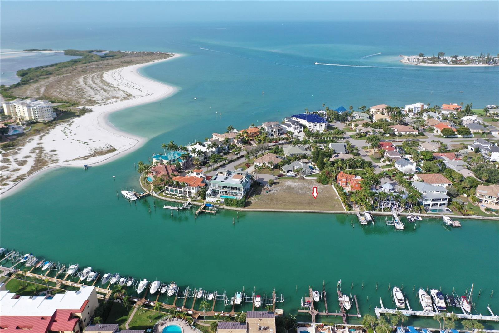 Discover the epitome of waterfront living with this exceptional deep-water lot on the Grand Canal in Tierra Verde. This rare opportunity allows you to design your dream home on a premier piece of paradise. Spanning 74.8 feet of direct waterfront access on a generous 66 x 171 lot, this property is a true haven for boat enthusiasts. Savor the refreshing breezes while watching dolphins and manatees glide by.
Positioned at the entrance to the Grand Canal, this lot offers quick and easy access to the Gulf of Mexico, the Intracoastal Waterway, and Tampa Bay, making it an ideal location for boating adventures. In addition to its unrivaled water access, the property is just minutes from world-famous beaches and the iconic Fort De Soto Park. Perfectly situated, the lot is only about 30 minutes from Tampa International Airport and St. Pete-Clearwater International Airport, with I-275 just 10 minutes away. This prime location allows for quick connections to downtown St. Petersburg (15 minutes), downtown Tampa (40 minutes), and Sarasota International Airport (50 minutes), ensuring convenient travel options for those with a jet-set lifestyle. Immerse yourself in the vibrant local culture with nearby restaurants, beautiful beaches, and the bustling downtown St. Petersburg area. Don’t miss the chance to own this rare piece of waterfront tranquility in Tierra Verde—where every day feels like a vacation in paradise.