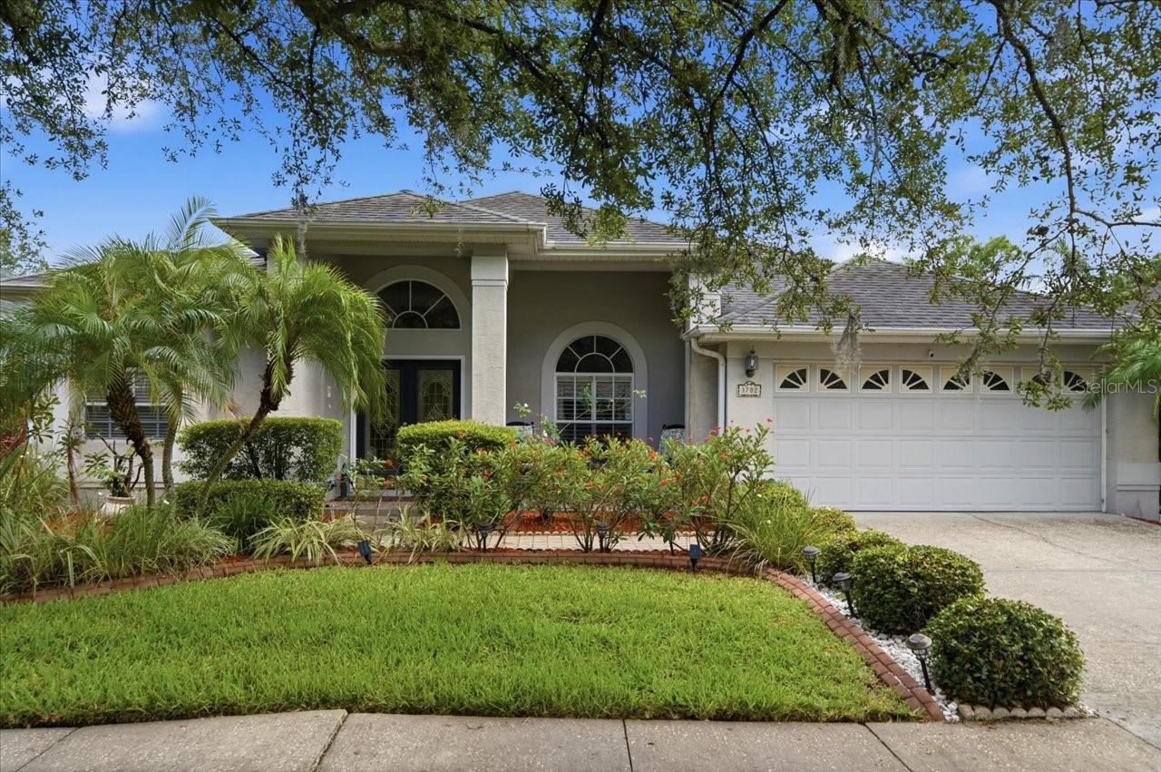 Welcome to this spacious 4-bedroom, 3-bathroom pool home featuring a desirable split-bedroom floor plan and plenty of room for both everyday living and entertaining. As you enter, you'll be greeted by formal living and dining rooms highlighted by soaring vaulted ceilings that create an open and inviting atmosphere. The owner's suite is privately situated and offers elegant chair rail molding, a large walk-in closet, and an en-suite bath featuring dual sinks, quartz countertops, a relaxing garden tub, and a separate walk-in shower. At the heart of the home, the kitchen is designed for gathering and functionality, featuring warm wood cabinetry, granite countertops, a center island, and a seamless flow into the spacious family room, with a wood burning fireplace. Two secondary bedrooms are conveniently located off the kitchen and share a guest bath with a tub/shower combination. The fourth bedroom is tucked away at the rear of the home, providing flexibility for guests, a home office, or multigenerational living, and is located directly across from the pool bath for added convenience. Step outside to enjoy your private screened pool area, perfect for relaxing, entertaining, and enjoying Florida's year-round sunshine. With its thoughtful layout, multiple living spaces, and desirable pool setting, this home offers the perfect blend of comfort and functionality. You can even walk to Gaither High school if needed