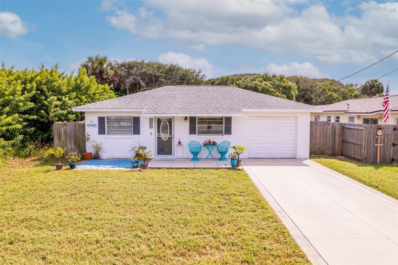 ONE OF A KIND LOCATION AND LOT SIZE!  Beach living at its best!  Just one block from the ocean.  Make this your charming home or use it as a weekend getaway spot.  Bright and cheery interior with 2 bedrooms, 2 bathrooms, 1 car garage, an updated kitchen, new laminate flooring, new fencing, and a newly remodeled master bathroom.  The updated kitchen includes new cabinets, new countertops, new tile backsplash, and new appliances.  Offered partially furnished with the dining room table and chairs, side entry table, and most pictures on the walls staying for the new buyer to enjoy!  Large backyard with room for a pool.  You will love the location and short trip to downtown New Smyrna Beach.  Enjoy morning coffee on your front porch or back Florida room overlooking the mature oaks and fully fenced in backyard.  The lifestyle here is all about the laid-back beach vibe and thankfully you are just a short walk or bike ride away from New Smyrna Beach's white sandy beach.  Come live the Florida Life! ;Water: City