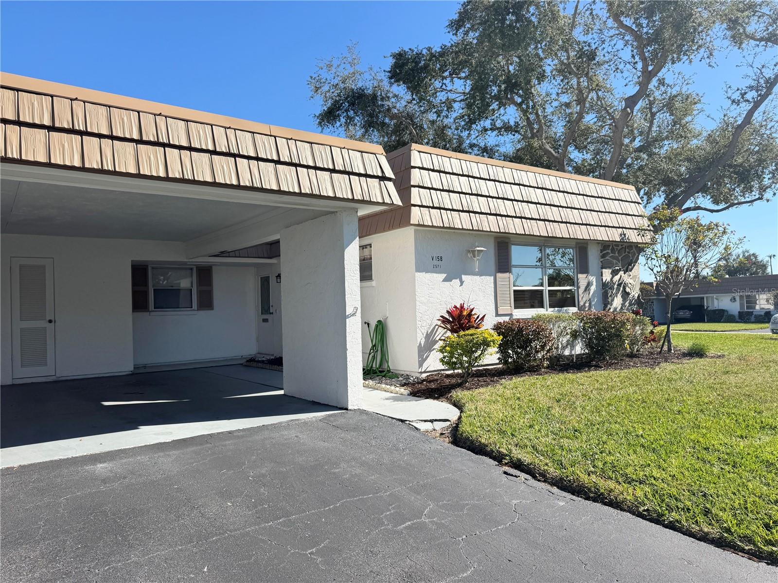 VALUE PRICED! Villa 158 is a large C Model, originally built with a 12x30 screened porch/lanai, but professionally remodeled with screens, glass windows and air conditioned. This makes the square feet 1569 according to the Builder, the Paver Brothers. This villa has a new roof as of 2022. Tile floors throughout except for living room and Florida room ( former lanai ). The furniture is comfortable and negotiable. Villa is open and great for entertaining. It's just 4 blocks to the Clubhouse, Heated Pool and Marina. Less than 1/2 mile to shopping and even closer to the convenience store with one of the best egg salad sandwiches in town. The Community is one of the most socially active communities in the area. The happy community life offered here centers around the Recreation Complex. In the main building, a huge party-game-meeting room is equipped with dining tables, card tables, pool table, ping pong table, shuffle board table and audiovisual equipment and it's own complete kitchen. Poolside parties are easily accommodating, with one whole wall of sliding glass doors in the principal room leading you out to a full terrace, the Heated pool and shuffle board courts. The Clubhouse also has a lending library, card rooms, male and female saunas and two exercise rooms. Office manager is available 5 days a week. Villa 158 comes with it's own personal attached utility room for washer, dryer & water heater, and great for hobbyist or handyman. Villa 158 has a great location, approximately 2 miles to Siesta Key and 7 miles to Bayfront at Marina Jack's, Downtown Sarasota's restaurants and theatres. This Villa is hidden from traffic views. Boat docks are available with a rental fee of $1,344-a year, with direct access to over 4,000 feet of protected sea wall and docking for residential boats with easy access to Intercoastal Waterway, Bay and Gulf. And last but not least there are 2 pets welcomed; not to exceed 15" at the shoulder. If you are looking for a Spacious Villa This One is for You!