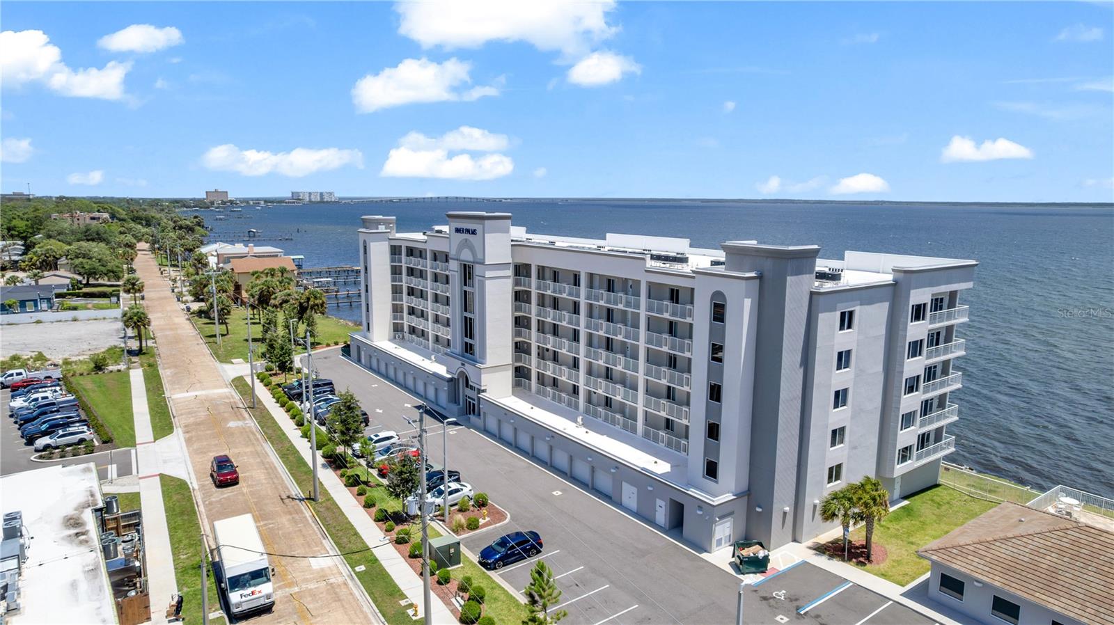 Panoramic river views. Rocket launches from your balcony. Welcome to the waterfront lifestyle you've been waiting for. Nestled along the shimmering Indian River in the heart of Titusville, this stunning condo offers the rare combination of breathtaking natural beauty, thoughtful modern design, and effortless coastal living. From the moment you step inside, natural light and sweeping water views set the tone. The spacious, open-concept living area flows seamlessly onto a private balcony overlooking the Indian River, where every morning begins with a coffee in hand and ends with the glow of a waterfront sunset. Watch rocket launches light up the sky from Kennedy Space Center, greet the sunrise over the water - This is your front-row seat to the Space Coast at its most magical. Inside, no detail has been overlooked. Wood-look tile flooring, fresh neutral tones, and a clean contemporary palette create a bright, airy ambiance throughout. The kitchen and bathrooms are appointed with granite countertops and sleek modern cabinetry, while the primary suite's oversized glass walk-in shower delivers a true spa-like escape. Wake up each morning to river views from your primary bedroom, a private retreat that makes it easy to forget the rest of the world exists. Peace of mind comes built-in with hurricane impact windows and sliding glass doors in both the living room and primary bedroom, offering exceptional energy efficiency and storm protection without sacrificing the stunning vistas that define this home. A versatile den rounds out the layout, offering the flexibility to create a dedicated home office, comfortable guest suite, or cozy reading nook. Whatever your lifestyle calls for, this home delivers. And with not one but two owned garage spaces, including an oversized bay, storage and convenience are never an afterthought. Beyond your front door, the best of Florida living awaits. World-class beaches, the iconic Kennedy Space Center, boutique shopping, acclaimed dining, and the excitement of Orlando's attractions are all within easy reach. Yet once you're home, it all feels wonderfully far away. Move-in ready. Maintenance-free. Endlessly breathtaking. If waterfront living on the Space Coast has been your dream, this is where that dream begins.