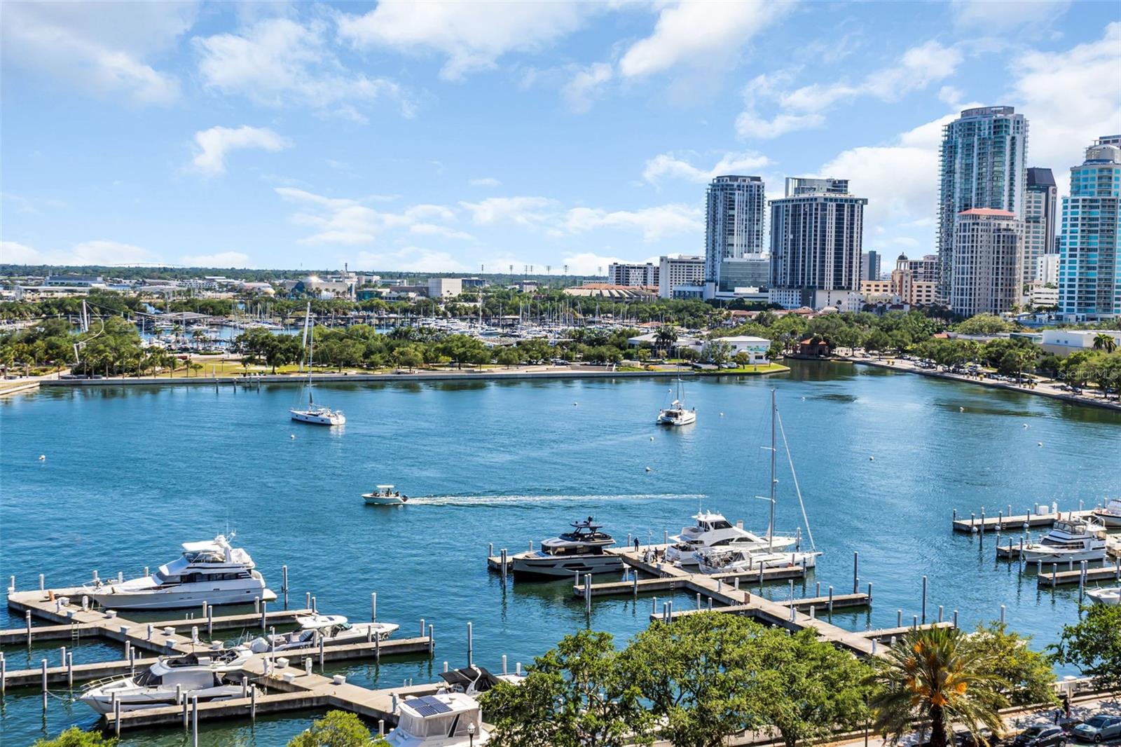 Experience timeless elegance and refined waterfront living at the iconic Vinoy Place, one of downtown St. Petersburg’s most prestigious addresses. Perfectly positioned along the shimmering shores of Tampa Bay, this exceptional 11th floor, 3-bedroom, 2.5-bath residence spans approximately 3,000 square feet and captures breathtaking panoramic views of the marina, the St. Pete Pier, lush waterfront parks, and the sparkling bay beyond.

From the moment you arrive, you’re escorted via a private en-suite elevator that opens directly into your personal foyer—an enviable feature that offers both heightened security and a true sense of arrival. A secondary entrance provides additional convenience and flexibility for both residents and guests. Inside, you’re welcomed into an expansive, light-filled interior where walls of glass frame the ever-changing coastal backdrop. Six primary view windows are enhanced with power-operated shades, allowing you to effortlessly tailor light and ambiance throughout the day. Multiple private terraces—three in total—offer a seamless extension of the living space, creating the perfect setting for morning coffee overlooking the marina or evening cocktails as the city lights reflect across the water. From this elevated vantage point, enjoy front-row views to St. Petersburg’s most celebrated moments—spectacular Fourth of July fireworks, New Year’s Eve displays, and dazzling waterfront drone shows that light up the downtown skyline.

Designed for both everyday comfort and elevated entertaining, the chef’s kitchen is a standout feature, appointed with granite countertops, a double oven, and abundant cabinetry. The adjacent living and dining areas flow gracefully, offering generous proportions rarely found in today’s market.

The primary suite is a true retreat, offering exceptional scale, dual walk-in closets, and a spa-inspired bathroom. A versatile third bedroom offers flexibility to serve as a private home office, creative studio, or additional guest space, adapting effortlessly to your lifestyle needs. The guest accommodations are equally impressive, including a private suite with its own bath and balcony—perfect for hosting family and friends.

Thoughtful infrastructure and upgrades enhance both convenience and peace of mind, including dual A/C systems, two water heaters (with a tankless system servicing half the residence), pre-wired Cat 5 connectivity, and abundant storage throughout—plus a large, separate storage unit. Two secured parking spaces (one handicap accessible) and controlled-access elevator entry further elevate the ease of living.

Residents of Vinoy Place enjoy a resort-caliber lifestyle with an array of meticulously maintained amenities. A grand two-story lobby with sweeping staircase and elegant chandeliers sets the tone for the building’s classic sophistication. Additional features include a gated guardhouse with 24/7 staffing and video surveillance, a porte cochère for effortless arrivals, a formal social room with a stone fireplace, a catering kitchen, billiards and media rooms, and a poolside cabana overlooking the heated pool and spa.

All of this is just steps from the vibrant energy of downtown St. Petersburg—renowned dining, boutique shopping, waterfront parks, and cultural attractions—offering the perfect blend of serene coastal living and dynamic urban convenience.
