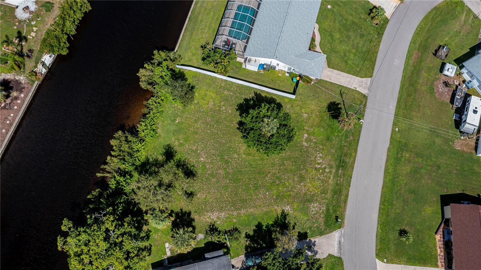 GULF ACCESS Oversized lot right on the Sunrise Waterway! Here is your opportunity to own over ½ acre with quick Gulf Access if you purchase with the home next door, 156 Cambridge, MLS: C7482085,  this lot is about a 12 to 15 minutes by boat to the Charlotte Harbor.. Dolphins and Manatees visit frequency.  This oversized lot offers plenty of space for a large home with pool. Public water and public sewer, Electric, high-speed internet as well.  Situated close to shopping, entertainment, dining, health care, educational facilities. The new Sunseekers resort is close by either by boat or car.  Survey already done. Ready to build. Not many oversized lots available with this type of Gulf Access.