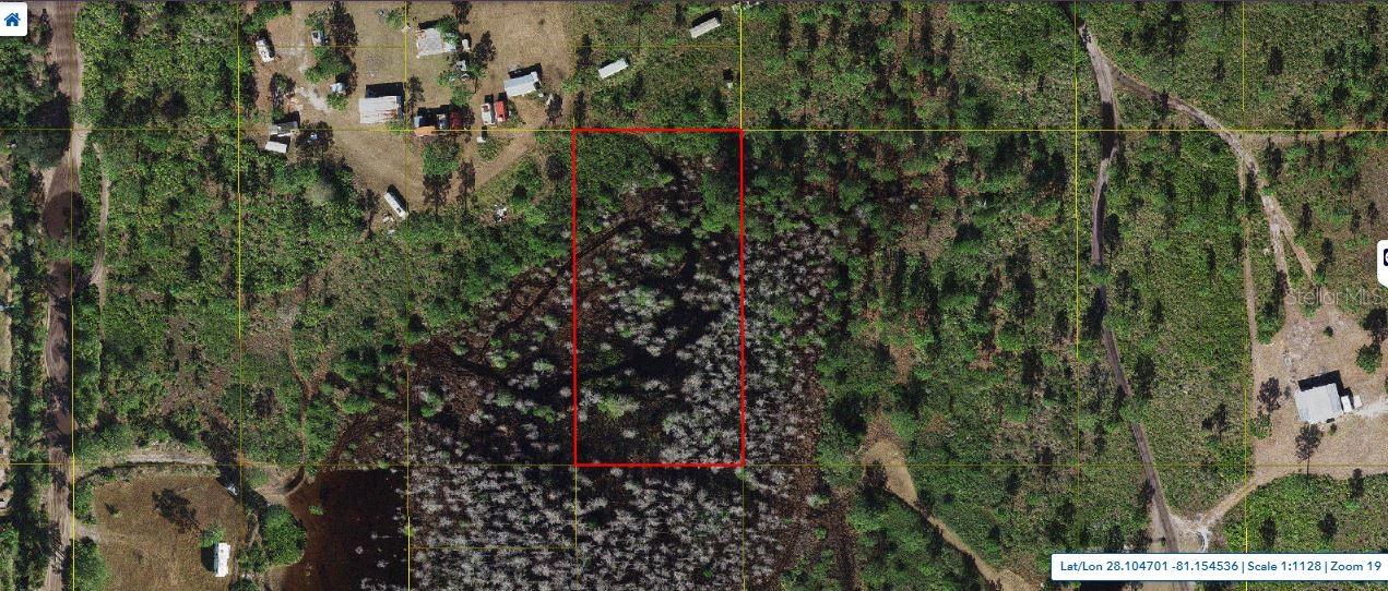 1.26-acre agricultural lot on Holopaw Groves Road in St. Cloud, Florida 34772.  "Zoning: OAC" Rural acreage not build able. this acreage is ideal for recreational use, long-term investment, or enjoying the privacy and natural surroundings away from the city. Pin Location: Latitude 28.10522588, Longitude -81.15668605. Note: buyers I emphasize the importance of conducting thorough due diligence to ensure that the property meets your expectations and requirements.