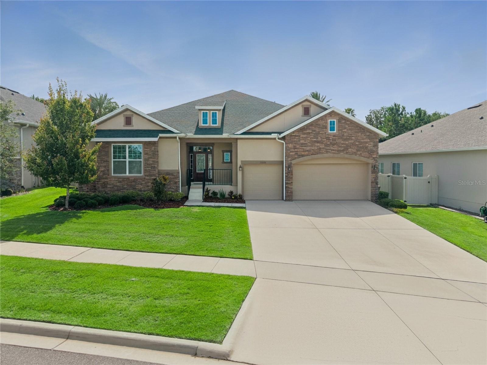 **CLERMONT CHARMER** Built in 2021 by David Weekley, this meticulously maintained 4-bedroom, 3.5-bath home offers a triple-split floor plan and no rear neighbors. The spacious, open-concept design features high ceilings, 8-foot doors, a custom shiplap accent wall, updated lighting fixtures, and custom window treatments that convey with the home. The oversized kitchen island provides abundant storage and serves as the heart of the home. A versatile bonus/flex room with glass French doors and second living/family room offer endless possibilities for a playroom, home gym, or game room. The primary bedroom features 12-foot ceilings, a spa-inspired bath with a freestanding tub, walk-in shower, and oversized walk-in closet. One guest bedroom includes an en-suite bath, while two additional bedrooms share a full bath. Enjoy outdoor living on the large covered lanai, and the home is already pre-wired for future pool installation. The 3-car garage features premium Shark epoxy flooring. This community is conveniently located near the downtown districts of Winter Garden and Clermont, with easy access to dining, shopping, breweries, coffee shops, the West Orange Trail, major attractions, Downtown Orlando, Walt Disney World, and the Orlando International Airport. With its desirable floor plan, 3-car garage, and no rear neighbors, this nearly new David Weekley home is an opportunity you won't want to miss. Schedule your showing today!