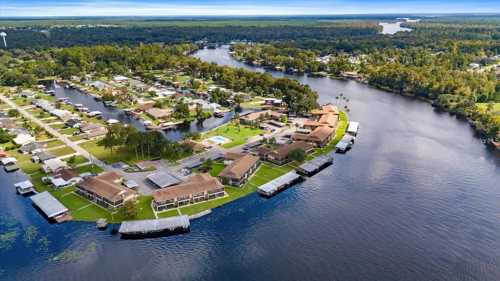 One or more photo(s) has been virtually staged. FLORIDA LIVING at its easiest and finest! Low maintenance Condo! Go FISHING, BOATING and LOVING FL life during the day, and when you return, it's just steps away to your 1st floor Condo!
On the Saint John's River, with your designated BOAT slip and lift! 
HOA allows 30 day or more Short term leases, so Airbnb when you’re not there! Perfect for escaping Cold Northern Winters! Have a second vacation home! **Ask about Special Investor loans to use as a rental property!**
Come home to unwind in your updated, 2 bedroom, 1 bath condo that's been renovated and ready for its new owner. This community features a community dock, fish cleaning area with water, and electricity, seating areas on the dock to wind down and watch the boats pass by. Soak in the recently updated community pool which is directly across the street from this condo unit. This Move in ready condo has been renovated with designer cabinets, granite countertops and expanded kitchen with a large island, great for entertaining. The main living spaces feature crown molding, and the entire unit has been recently painted inside. Designer touches are also seen in the high end plantation shutters on all the windows and sliding glass door, which leads to a large enclosed patio with River views. Are you ready to call this Riverfront condo, your new home?