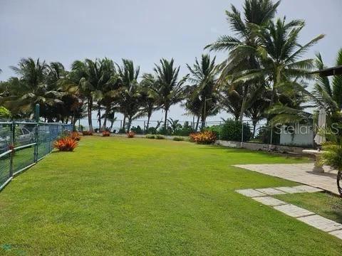 Fractional Ownership. Oceanfront Estate for Sale in Las Picúas, Río Grande, Puerto Rico — Experience the ultimate Caribbean beachfront lifestyle with this exclusive oceanfront property offering direct access to pristine shores and unobstructed Atlantic Ocean views. Located in the highly sought-after Las Picúas community, just minutes from the Wyndham Grand Río Mar Resort, this unique Río Grande real estate opportunity blends privacy, tranquility, and strong investment potential. The property features two versatile camper-style residences, ideal for vacation living, short-term rentals, or income-producing opportunities. Enjoy expansive outdoor spaces perfect for entertaining, relaxing, and embracing the tropical sea breeze. Situated in a quiet, low-density beachfront enclave near golf courses, fine dining, and resort amenities, this oceanfront estate is perfect for buyers seeking a luxury vacation home, Airbnb investment property, or private coastal retreat in Puerto Rico.