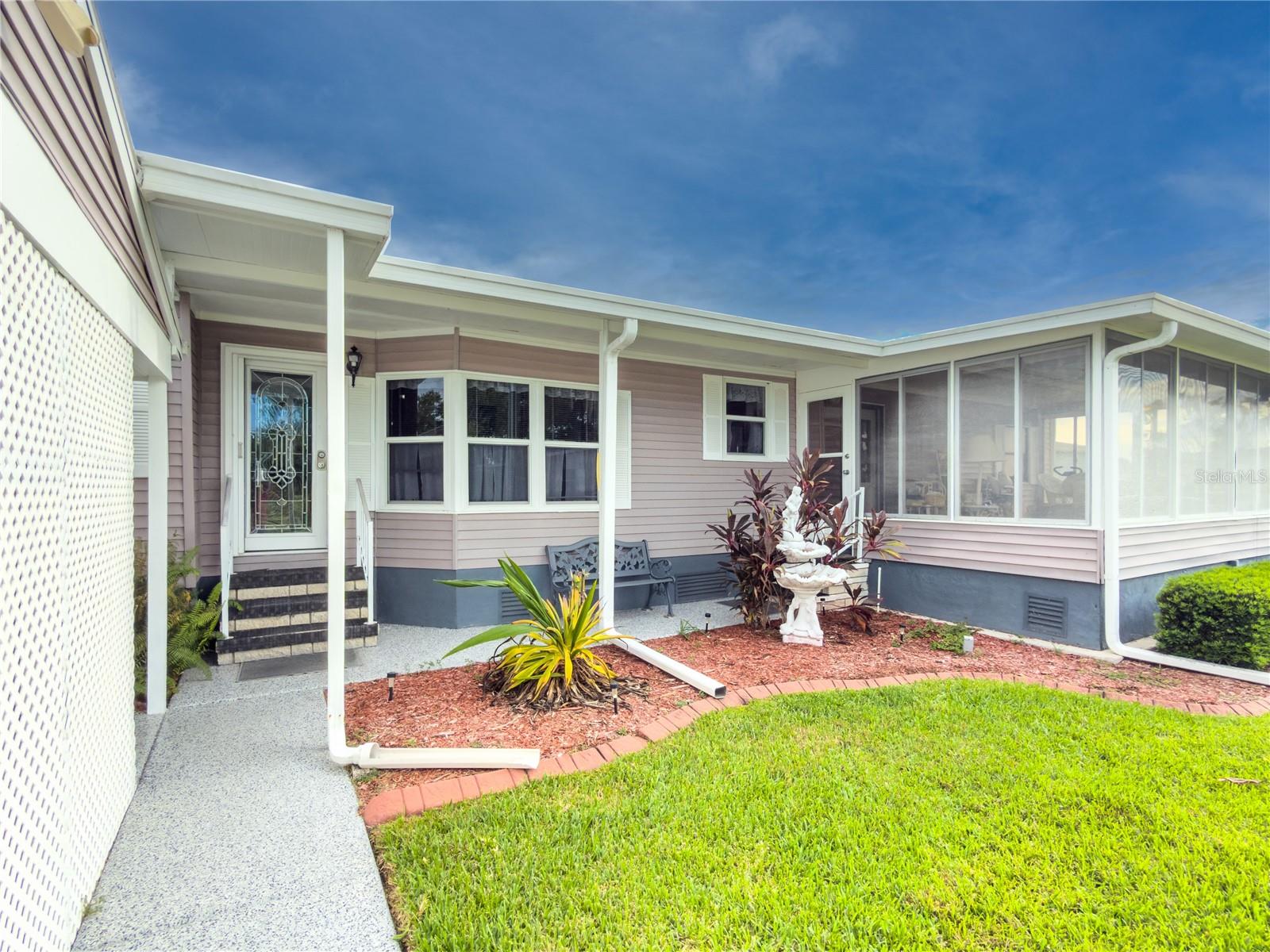 LAND OWNED…DOUBLE WIDE Manufactured home in the 55+ community of Ridgewood Oaks. This home offers a rare split floor plan with bedrooms on each side of the home. The kitchen is well appointed and features many cabinets, nice appliances and an eat-in dining area.  The large living room is open and connected to the formal dining area w/inside laundry area.  The primary bedroom is very large with plenty of room for a king-sized bed and has a deep walk-in style closet.  The Oaks at Ridgewood is a 55+ community that includes Spectrum internet and cable in its low quarterly fees along with weekly lawn maintenance and trash pick-up. The community has a beautiful clubhouse, pool, spa, tennis courts, pickle ball courts, shuffle board and a fun outdoor fitness area. Ridgewood is a golf cart, small pet friendly community with many activities and social events. Ridgewood has close access to I-75, many restaurants, the Ellenton Outlet Mall, Manatee County Library and provides 24-hour gated security. Don’t let this one get away!