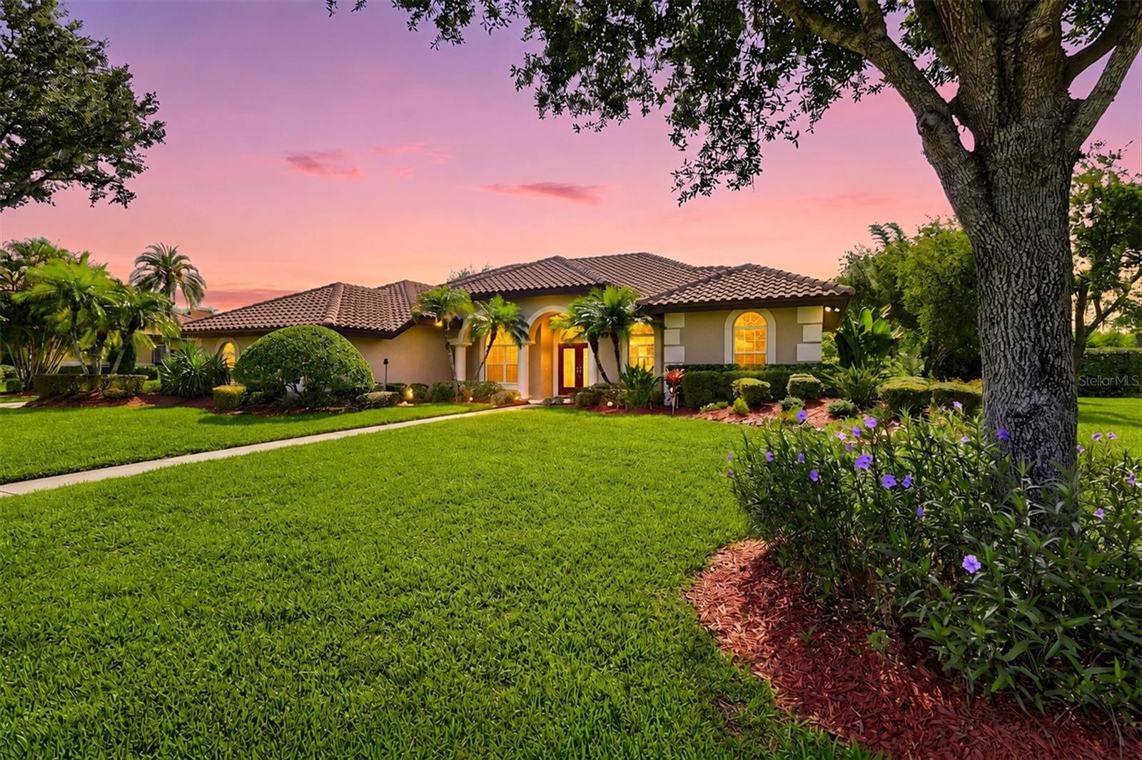 Many home buyers dream of a neighborhood like the gated community of Serenoa... it is a quiet street, canopy lined with mature trees and plenty of breathing room.  The lots here are HALF-ACRE+, the streets are calm with beautiful, quality homes throughout. It's a gated community with lakes, plenty of green space tennis and pickleball courts  with a golf course where MEMBERSHIP IS OPTIONAL. This spacious home is in a perfect location, close to TOP-RATED SCHOOLS, Siesta Key beach, UTC for shopping and dinner, Lakewood Ranch, downtown Sarasota, hospitals and five airports all within about an hour.

The house itself is a 4 bedroom, 3 bath, with a den, with a POOL AND SPA. It offers many nice touches including tray ceilings, arched doorways, built-ins, and large windows and many pocketing sliders that let in a plethora of natural light. The TILE ROOF IS YOUNG, INSTALLED IN 2023, POOL RESURFACED IN 2023, NEWER AC SYSTEMS (2023 AND 2024), AND THE HOUSE WAS COMPLETELY REPIPED IN 2024... all of these improvements give the next homeowner peace of mind. Hard flooring spans throughout the home, so it's easy to keep clean and is perfect for pets.

In the entry area, there is a formal dining room, sitting area/flex room with pool views and a den. The kitchen is at the center of the house, where the heart of the home should be, and it opens directly up to the family room and a breakfast nook area, where entertaining or family relaxing time is easy. Light colored cabinets, a big island and breakfast bar, a dry bar, a built-in desk, and a walk-in pantry big enough for real grocery runs are gifts that this home offers. You have pool views from the kitchen and family room as well.

You will enjoy the large, NEWLY SCREENED, NEWLY PAINTED lanai where there is plenty of room for family and friends, and where you can sit to enjoy watching our Florida wildlife while sipping your coffee or cocktail. The pool is surrounded by landscaping AND plenty of space between homes that gives the wonderful feeling of privacy.

The master bedroom is split from the extra bedrooms for privacy. The primary suite has its own pool access, an expansive walk-in closet, and a bathroom with two vanities, a soaking tub, a separate shower, and its own water closet. Two of the other bedrooms share a Jack-and-Jill bath, and the fourth bedroom is off by itself with its own full bath and a door out to the lanai... good setup if you've got guests or family staying with you. The garage fits three cars and is extra deep, with a wide driveway to match. Storage isn't an issue anywhere in this house.

This solid, well-built home is in a sought-after neighborhood where people love living. Come visit in person... come see, come sigh, come make this home your own.