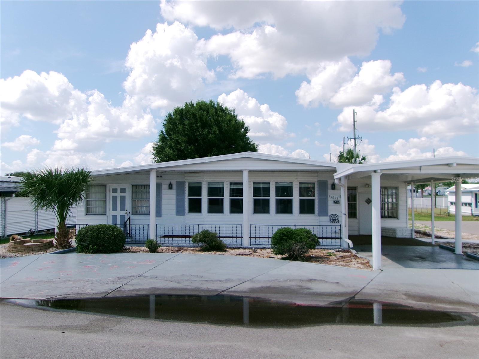 This  1977 Mobile Home in Zephyr Shores Mobile Home Park features a large enclosed porch to the rear that could be perfect for entertaining,  plus  two addition enclosed rooms to either side of this double wide mobile home.  Property sits on a corner lot in an area that has flooded in the past. This dwelling has sustained damage due to the flooding.  This would be an opportunity to renovate to your taste and add features to minimize future flooding damage.    Zephyr Shores is an established mobile home park in Zephyrhills  with a combination of winter only residents and full time residents. It is located between Wesley Chapel and Zephyrhills .
Zephyr Shores is  an active 55+ mobile home park featuring a shared pool and clubhouse, offering residents access to recreational amenities and an established residential setting. This location appeals to investors, or owner-occupants willing to take on improvements.  Schedule a showing today to evaluate the property's potential and explore this location.