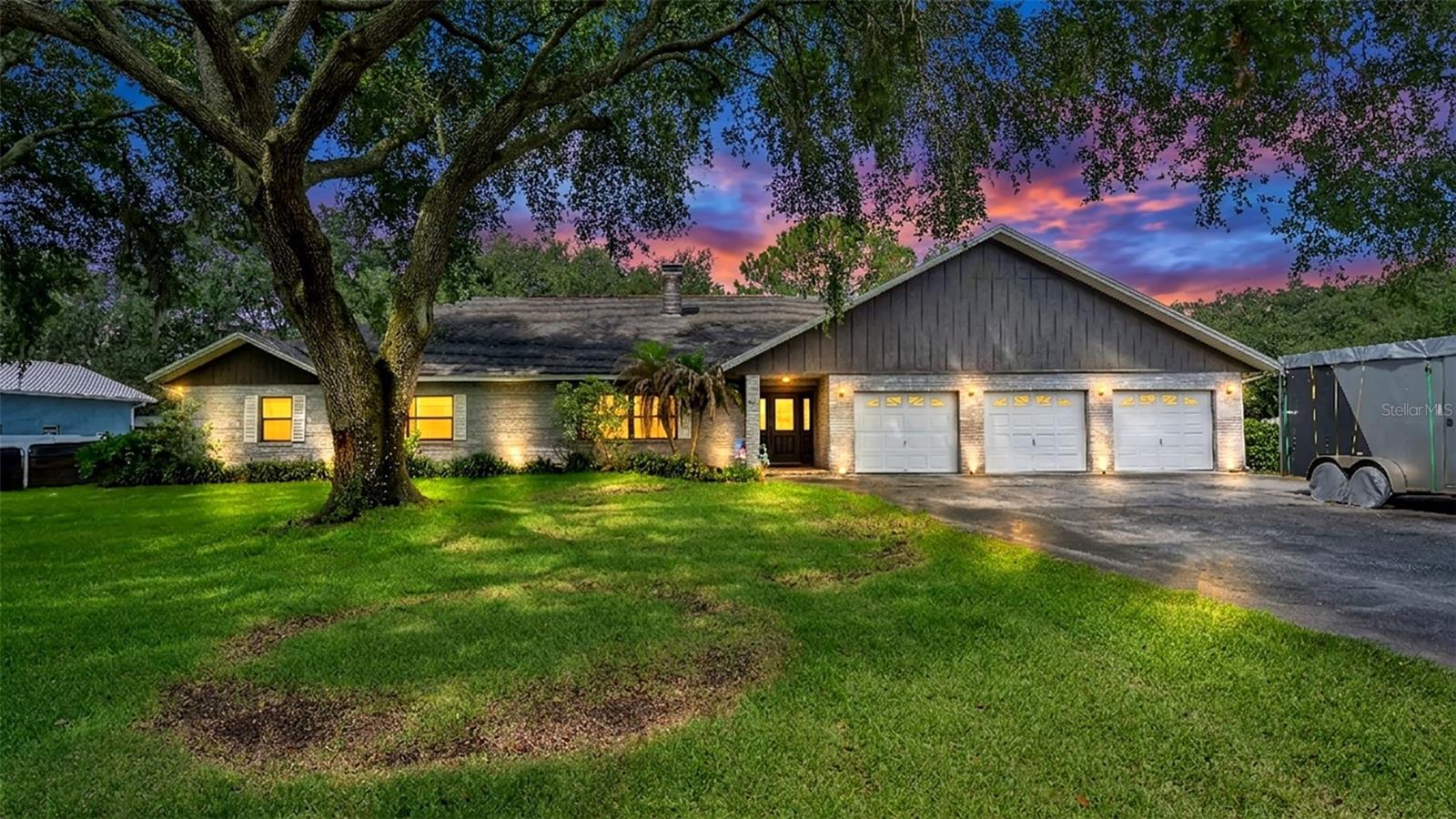 Welcome to your own private retreat! Nestled on 2 secluded acres, this stunning property offers the perfect blend of space, privacy, and functionality. Featuring 3 bedrooms, 2 full baths, and 2 half baths, this home boasts an open floor plan designed for both comfortable living and effortless entertaining. Step outside to your expansive lanai and sparkling pool, ideal for enjoying Florida living year-round. With a 3-car attached garage plus a 2-car detached garage, there’s no shortage of room for vehicles, hobbies, or storage. Additional highlights include a Generac generator, fenced backyard, two storage sheds, and a brand new water heater. No HOA and ultimate privacy make this a rare find—your secluded slice of paradise awaits!