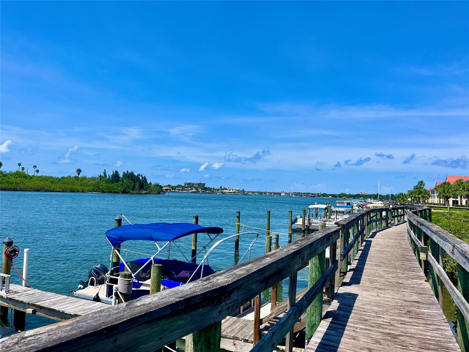 Direct Intracoastal Condo with Fantastic Views of the Intracoastal Waterway, Sunsets, Dolphins and more.  This Impeccably Fully Furnished Remodeled Home with Vinyl Plank Flooring, Granite Counters throughout, Beautiful Bar Area with Wine Cooler, A/C new 2023, plus the 24' x 9' porch has been incorporated into the living space bringing Sunlight and Sweeping Views of the Intracoastal Waterway down to the South Bridge.  Look no further for your piece of Paradise in New Smyrna Beach.  This Model style Home is ready for you to move into, just bring your Bikes and Fishing Poles.  New Roof 2022 and Painted 2023. Bouchelle Island has so much to offer with a 18 Hole Pit and Put Golf Course, 2 Swimming Pools, Hot Tub, Fitness Centre, Tennis, Pickleball, Shuffleboard, Clubhouse, Boat Slips for Rent, Dry Boat Storage and Private Boat Ramp, Kayak Storage, Entertainment Area with Fire Pit.  Bike or Walk  to the Famous Flagler Avenue and Canal Street filled with Restaurants and Shops. 13 FT Boston Whaler available as a separate sale. ;Water: City