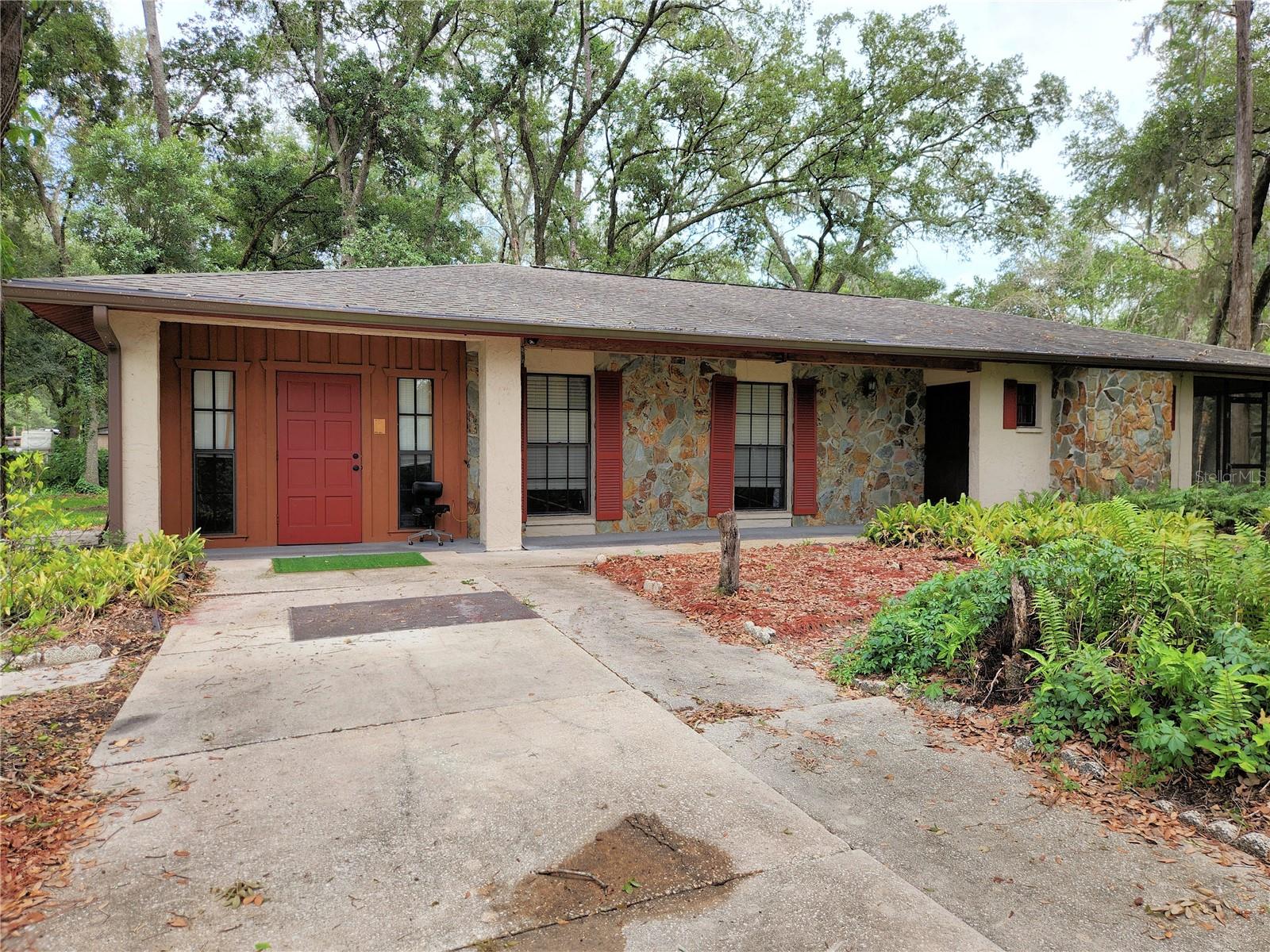 A one owner and loved BLOCK AND STONE home, now needs a bit of TLC, on a very charming tree filled 1 acre + site, in an established and yes, quiet neighborhood.  EASY EASY reach (Off HWY 579, Mango RD) to everywhere in East Hillsborough County, and close to I-4 for areas beyond.  Three good sized BR's, decorative only fireplace in living room, and a big screened porch to enjoy the morning and evening breezes. Agricultural zoning and NO HOA will allow chickens, and other animals. Live how YOU want! There is a 2BR 1BA small trailer in the rear that was lived in by the owner's son for many years, and is in livable condition, hooked up to well and septic. Possible rental income here.  A small pole barn, and block storage building also. NEW ROOF IN 2022.