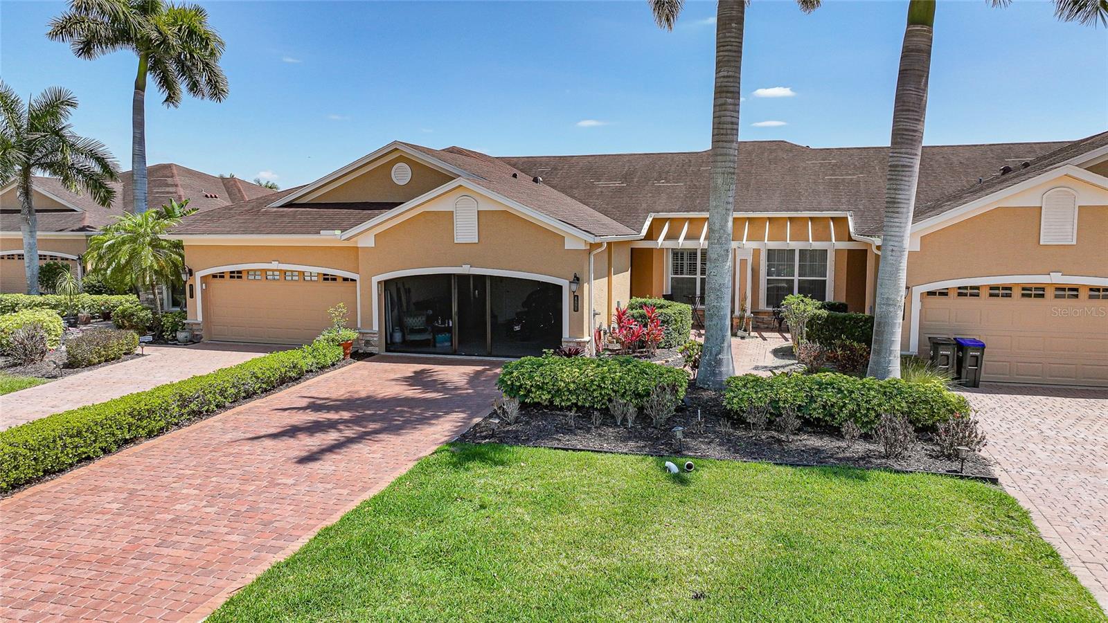 LOW-MAINTENANCE FLORIDA LIVING IN A BEAUTIFULLY MAINTAINED COMMUNITY—JUST STEPS FROM THE POOL! Welcome to this CHARMING 2 BEDROOM, 2 BATHROOM, 2-CAR GARAGE VILLA in the heart of North Port, where comfort, convenience, and lifestyle come together seamlessly.

Nestled within a WELL-KEPT COMMUNITY known for its MATURE, LUSH LANDSCAPING and pride of ownership, this villa offers a peaceful setting while still being close to everything North Port has to offer. One of the standout features is the SHORT WALK TO THE COMMUNITY POOL, making it easy to enjoy sunny Florida days without the upkeep.

Step inside to discover HIGH CEILINGS and an OPEN FLOOR PLAN that create a bright, airy feel throughout the main living spaces. The layout is ideal for both everyday living and entertaining, with a WELL-SIZED KITCHEN featuring AMPLE CABINETRY and generous counter space, giving you plenty of room to cook, host, and gather.

The PRIMARY SUITE is a true retreat, offering a LARGE BEDROOM, DUAL WALK-IN HIS AND HERS CLOSETS, and a SPACIOUS EN SUITE BATHROOM complete with DUAL VANITY SINKS—providing both comfort and functionality. The second bedroom and bathroom offer flexibility for guests, a home office, or additional living space.

An ENCLOSED PATIO with ELECTRIC SHUTTER adds even more versatility, creating the perfect bonus area for a sitting room, hobby space, workout area, or whatever suits your lifestyle best.

Additional highlights include a 2-CAR GARAGE for extra storage and convenience, as well as a newer A/C system—ONLY 4 YEARS OLD—giving you added peace of mind.

Whether you’re looking for a full-time residence, seasonal getaway, or low-maintenance investment, this villa delivers the PERFECT BLEND OF SPACE, LOCATION, AND EASY FLORIDA LIVING.

Don’t miss your opportunity to own in this DESIRABLE, WELL-MAINTAINED COMMUNITY—schedule your showing today!