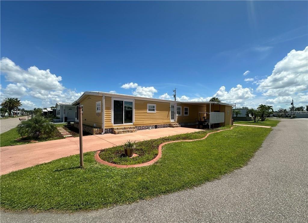 Excellent investment opportunity in this corner-lot home located in a premier 55+ Gulf-access, riverfront co-op community - SHARE INCLUDED! Property features 2 bedrooms, FLEX Room/Den and 2 bathrooms, Large owners suite with walk in closet. While the property sustained damage from Hurricane Ian, it has been remediated and cleared out. Other key upgrades include updated PVC plumbing, Miami Dade-rated windows &doors, Hardie Board exterior over Tyvek insulation & 5/8 inch sheathing plywood, a screened lanai, and 2 oversized driveways with parking for4+ cars and enclosed utility shed. This resident-owned community is designed for the active Florida lifestyle. Enjoy two pools, hot tub, fitness center, tennis, pickleball, bocce, shuffleboard, and basketball courts. Spend evenings watching sunsets at Palm Point Park’s 9-acre waterfront preserve, or take advantage of the 81-slip marina with boat & kayak launch for direct Gulf access through Lighthouse Marina. Whether you’re an investor ready to renovate or a buyer seeking an affordable entry into Southwest Florida waterfront living, this home offers both potentialand lifestyle. SOLD AS IS, CASH ONLY. No pets allowed.