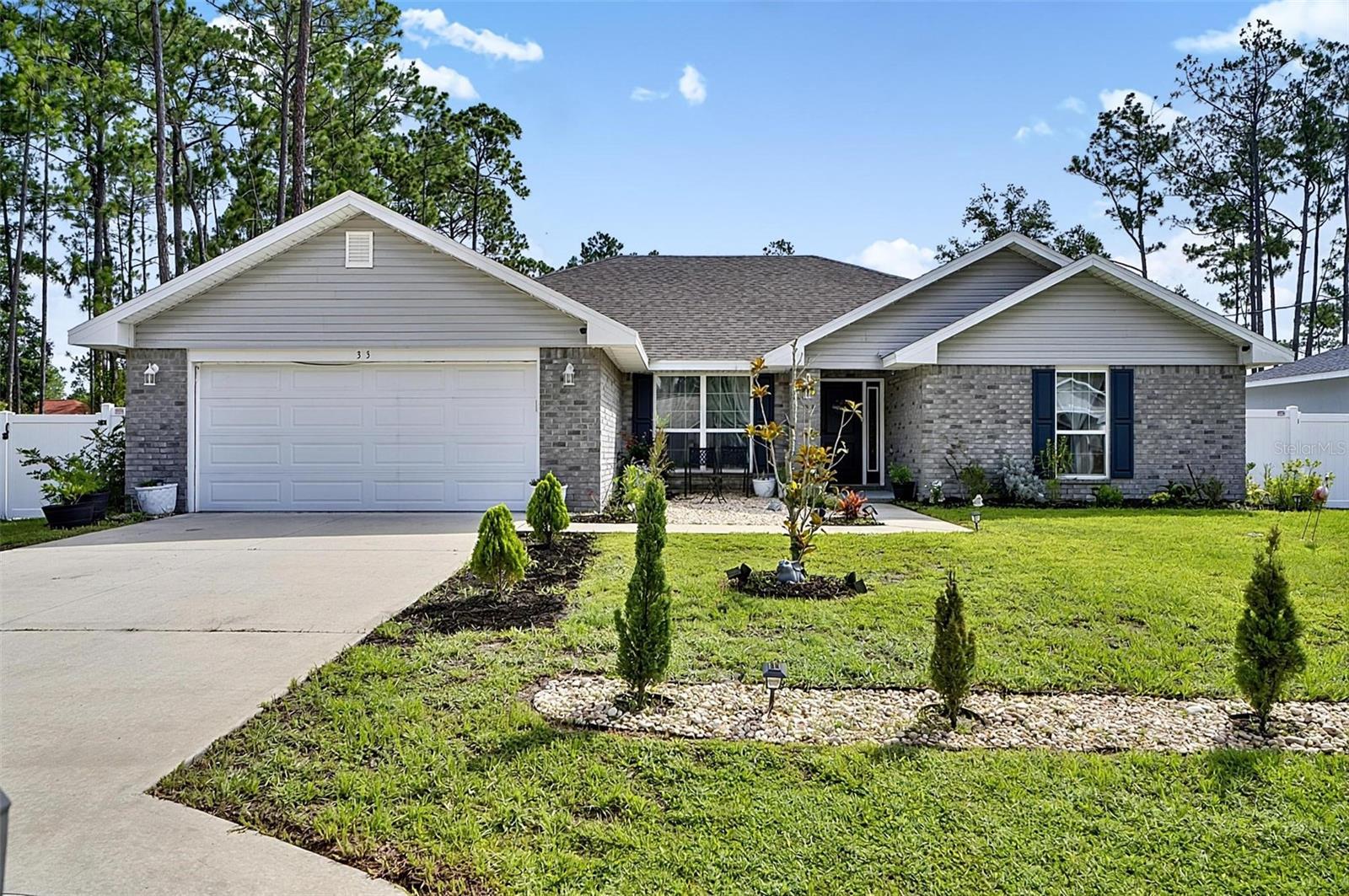 RARE OPPORTUNITY! Qualified buyers may be eligible to assume the seller's existing 4.99% interest rate loan, potentially saving hundreds of dollars per month compared to current market rates. Plus, the seller is offering up to $10,000 toward closing costs and or an interest rate buy down, creating exceptional value for today's buyers. Contact the listing agent for complete details. Built in 2022 and maintained in pristine, like new condition, this beautiful 4 bedroom, 3 bathroom home offers 2,117 square feet of thoughtfully designed living space with modern finishes and an inviting open concept layout. Upon entering, you'll be welcomed by soaring vaulted ceilings and an abundance of natural light throughout the main living area. The spacious kitchen overlooks the dining and living spaces, making it the perfect setting for entertaining guests or enjoying everyday family life. The desirable split floor plan offers privacy for the primary suite, while two secondary bedrooms are connected by a convenient Jack-and-Jill bathroom, providing both functionality and comfort for family members or guests. A third full bathroom and additional bedroom offer flexibility for a home office, guest suite, or growing family. Step outside to your private backyard retreat featuring a covered patio and a fully fenced yard ideal for pets, outdoor gatherings, or simply relaxing in your own peaceful space. The home also includes a full appliance package, making it truly move in ready. Best of all, this property is not located within an HOA, allowing you to enjoy the benefits of homeownership without additional association fees or restrictions. Don't miss this opportunity to own a like new home with valuable buyer incentives in one of Palm Coast's most desirable areas. Schedule your showing today!