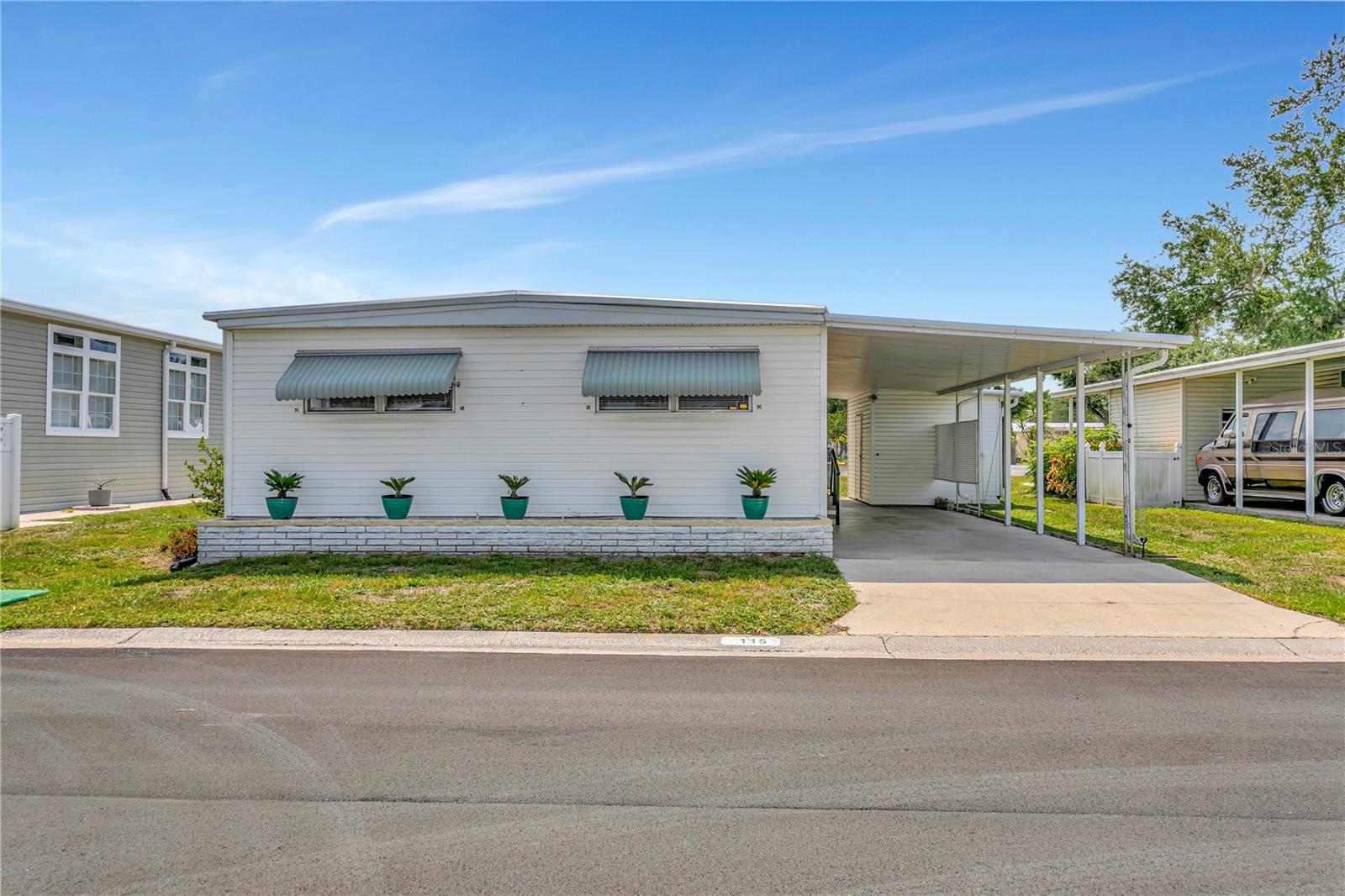 Step inside 115 White Oak Way and you immediately feel it—this isn’t just a beautiful home, it’s a fresh start wrapped in Florida sunshine. Set in Oakwood Manor, Sarasota’s only gated, resident-owned manufactured home community, this beautifully updated 2 bedroom, 2 bath double-wide invites you to relax, unpack, and start living the lifestyle you’ve been picturing. With approximately 1,280 sq ft of living space, including a 240 sq ft enclosed lanai, there’s room to spread out, host friends, or simply enjoy a quiet morning coffee in your own private retreat.  

As you walk through the new front door, the luxury vinyl plank flooring with premium underlayment gives the home a seamless, designer look while staying easy to care for. Your eye is naturally drawn to the 2025 kitchen—a true showpiece—with new cabinetry, quartz countertops, and stainless steel appliances that make cooking feel effortless and entertaining feel fun again. Both bathrooms continue the story with tasteful, modern finishes, while new ceiling fans, updated lighting, refreshed outlets, and the new front door complete the move-in-ready, “no projects needed” experience buyers are hoping to find. The roof was resealed in 2024, and a 2014 3-ton Rheem HVAC system helps keep things cool and comfortable all year, giving you the peace of mind that the big items are already taken care of.  

Location inside the community matters, and this home delivers. Nestled near both access gates and just a short walk to the clubhouse, you’re close to everything without being in the middle of it. Oakwood Manor spans 90 beautifully maintained acres and is known as the place “where fun and friendship happen.” For a remarkably low $210/month, you enjoy land ownership plus resort-style amenities: a welcoming clubhouse with commercial kitchen, event stage, audio/visual setup, dance floor, fitness room, activity hall, and library. Step outside to a large heated pool with handicap ramp, hot tub, remodeled shower facilities, and plenty of tables and loungers under the Florida sky. Shaded by majestic oaks, the park-like setting offers a gazebo, picnic tables, community grill, putt-putt golf, bocce ball, shuffleboard, ping pong, horseshoes, and cornhole—perfect for days when you want to be as active or as relaxed as you choose.  

For those who love the outdoors, the location is hard to beat. The community sits adjacent to the Legacy Trail and just steps from 12 newer pickleball courts, making it easy to walk, bike, or play a quick match with friends. And when you’re ready to explore, you’re only a short drive to Sarasota’s crystal-sand beaches, downtown shops and restaurants, the marina, fishing pier, local golf courses, museums, SRQ airport, Sarasota Memorial, and Doctors Hospital.  

Please note: Oakwood Manor is a 55+ gated, land-owned community and the only manufactured home park within the Sarasota city limits. Community rules do not allow motorcycles or dogs; only qualified service or therapy animals are permitted. If you’ve been searching for a beautifully updated home in a friendly, amenity-rich neighborhood at an affordable monthly cost, 115 White Oak Way offers the lifestyle, location, and peace of mind you’ve been waiting for.